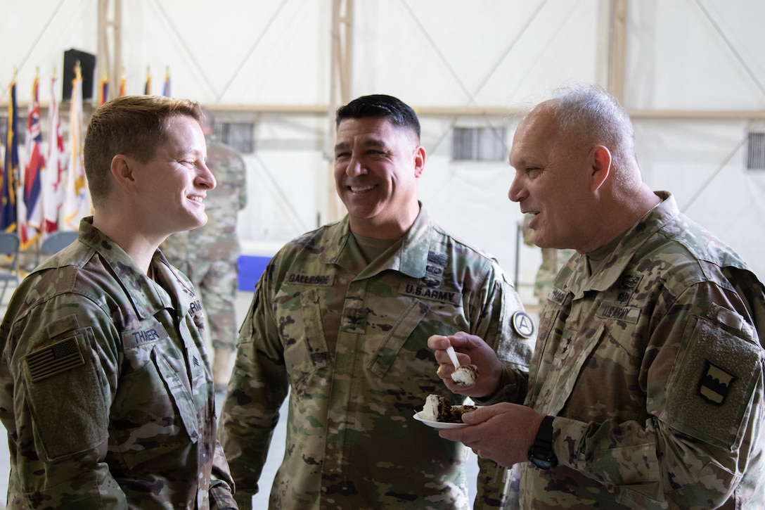 Maj. Gen. Bruce E. Hackett greets troops