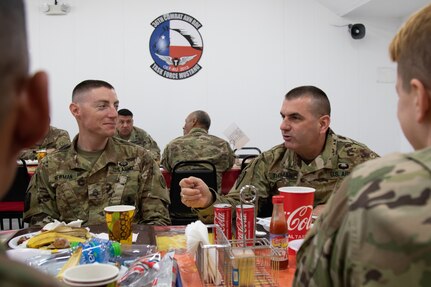 Maj. Gen. Bruce E. Hackett greets troops