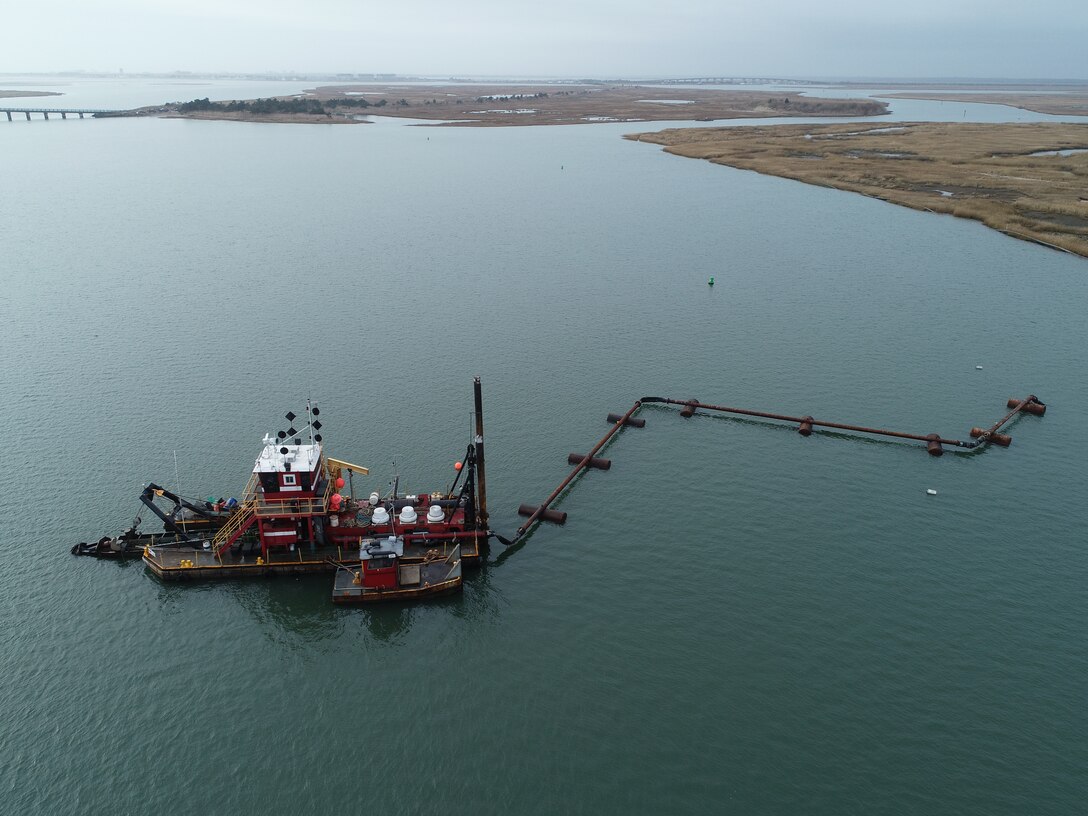The Dredge Fullerton, owned and operated by Barnegat Bay Dredging Company, conducts dredging in the New Jersey Intracoastal Waterway near Stone Harbor, NJ in 2019 as part of a U.S. Army Corps of Engineers project. The sediment was placed to create habitat on marshland owned by the New Jersey Division of Fish & Wildlife.