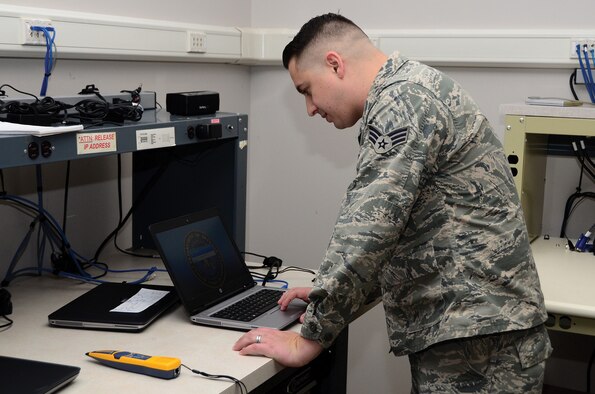 Senior Airman Kevin Jones, 445th Force Support Squadron, Communications Element client systems technician, re-images a laptop for a customer Nov. 2, 2019 on the imaging bench. Re-imaging the laptop allows Jones to rebuild the network profile and gives the machine the most up to date Windows version. (Photo by Staff Sgt. Darrell Sydnor)