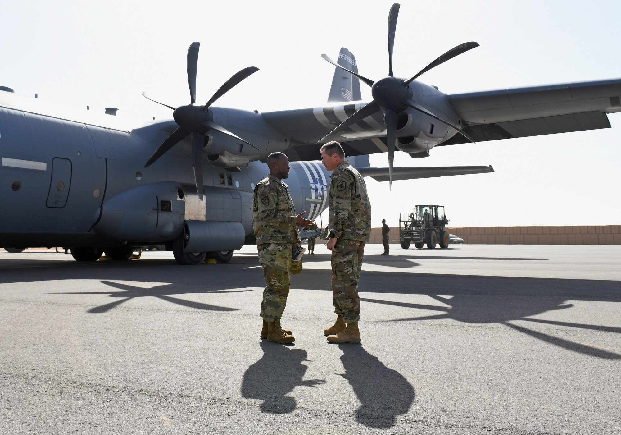 U.S. Air Force Brig. Gen. Ronald Jolly, left, U.S. Air Forces in Europe and Air Forces Africa director of logistics, engineering and force protection, speaks with Col. Jonathan Creer, 409th Air Expeditionary Group commander, at Nigerien Air Base 201, Agadez, Niger, Dec. 11, 2019. During his visit to the continent, Jolly traveled across West Africa to discuss the West African Logistics Network with local partners in the region and tour military installations where U.S. Airmen live and work. (U.S. Air Force photo by Staff Sgt. Alex Fox Echols III)