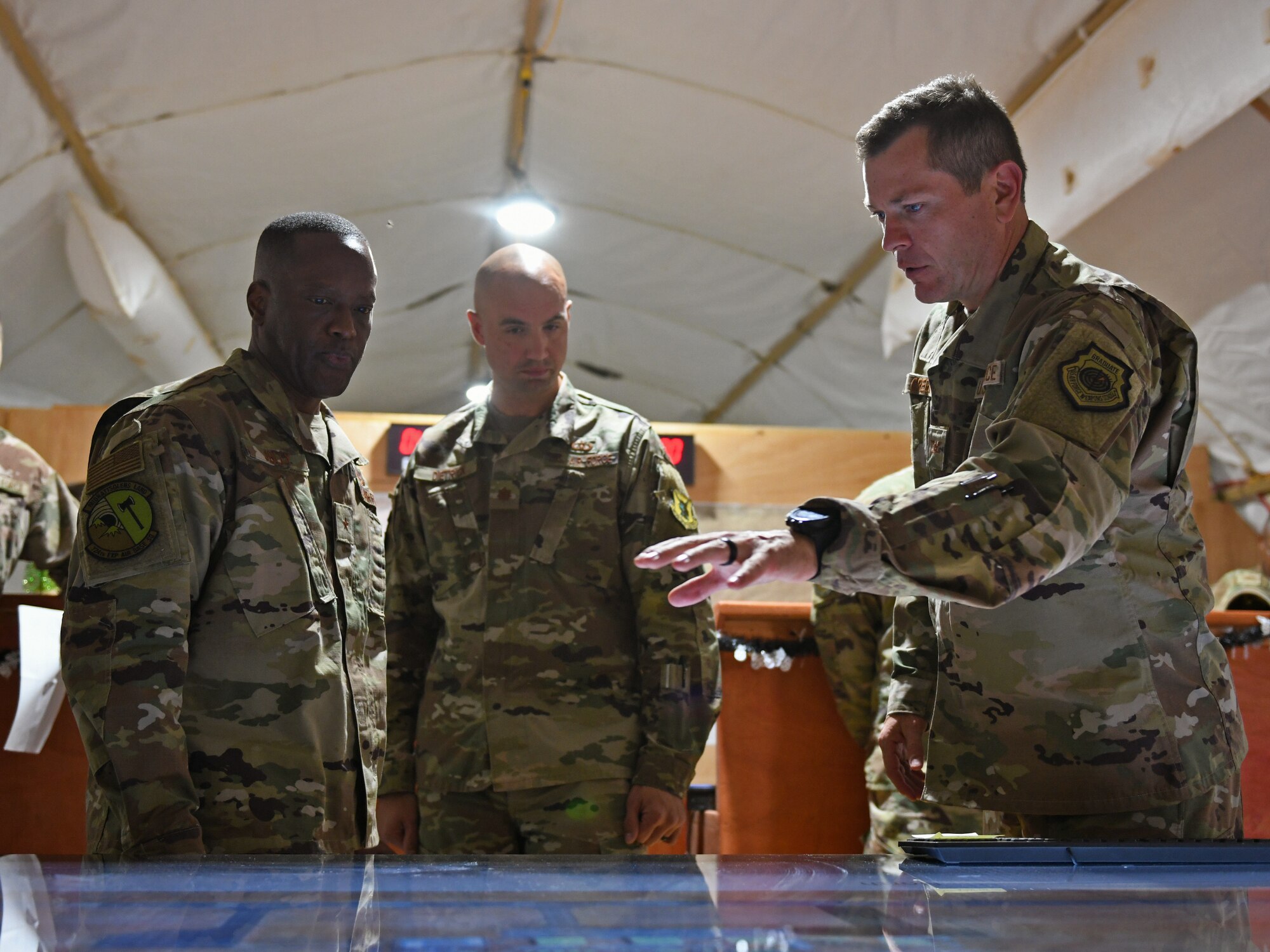 U.S. Air Force Col. Jonathan Creer, right, 409th Air Expeditionary Group commander, shows Brig. Gen. Ronald Jolly, left, U.S. Air Forces in Europe and Air Forces Africa director of logistics, engineering and force protection, key locations on a digital map of the installation at Nigerien Air Base 201, Agadez, Niger, Dec. 11, 2019. During his visit to the continent, Jolly traveled across West Africa to discuss the West African Logistics Network with local partners in the region and tour military installations where U.S. Airmen live and work. (U.S. Air Force photo by Staff Sgt. Alex Fox Echols III)