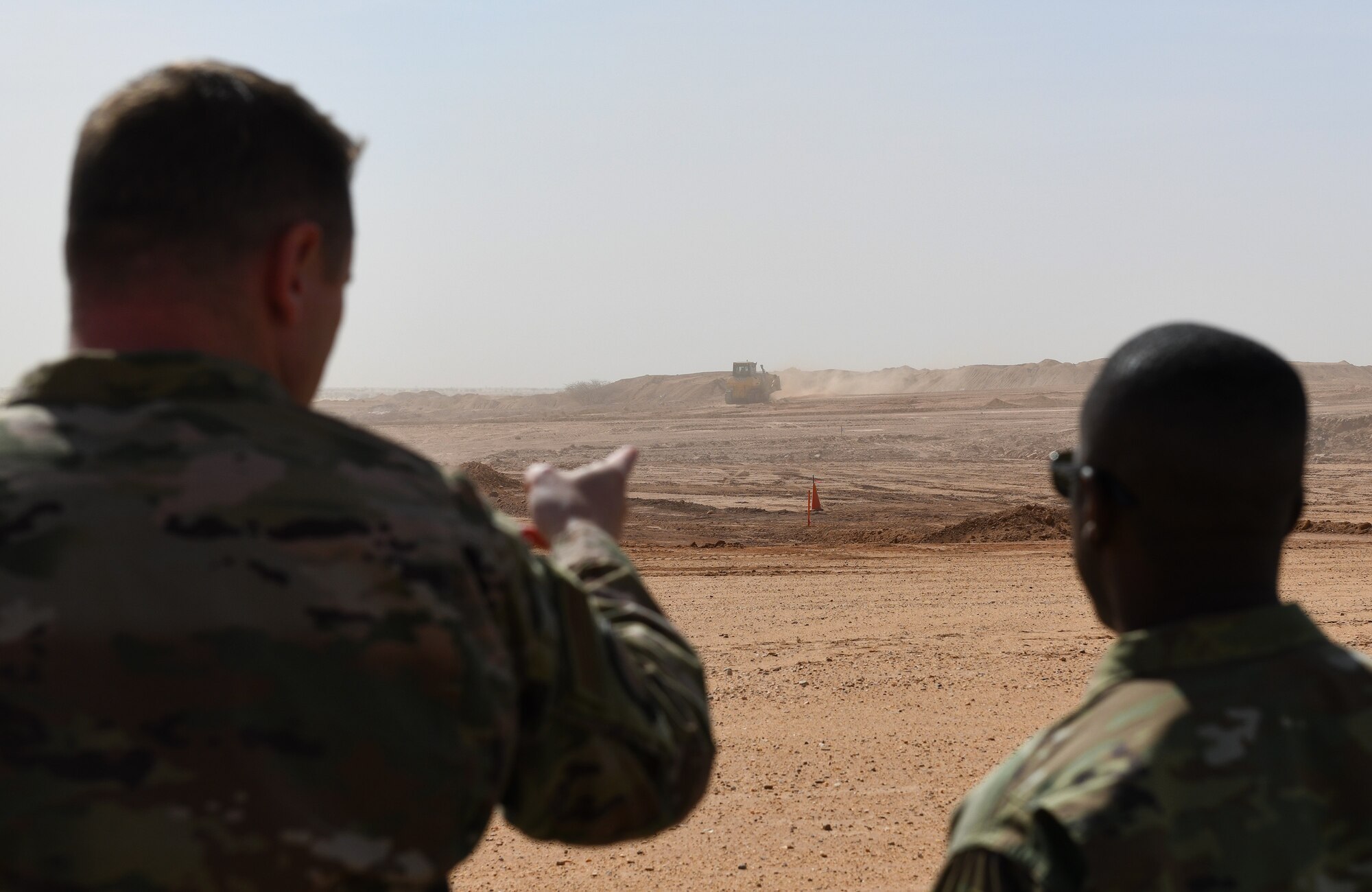 U.S. Air Force Maj. Joshua Poulton, left, 819th Expeditionary Rapid Engineer Deployable Heavy Operational Repair Squadron Engineers commander, shows Brig. Gen. Ronald Jolly, U.S. Air Forces in Europe and Air Forces Africa director of logistics, engineering and force protection, his Airmen’s construction efforts at Nigerien Air Base 201, Agadez, Niger, Dec. 11, 2019. During his visit to the continent, Jolly traveled across West Africa to discuss the West African Logistics Network with local partners in the region and tour military installations where U.S. Airmen live and work. (U.S. Air Force photo by Staff Sgt. Alex Fox Echols III)