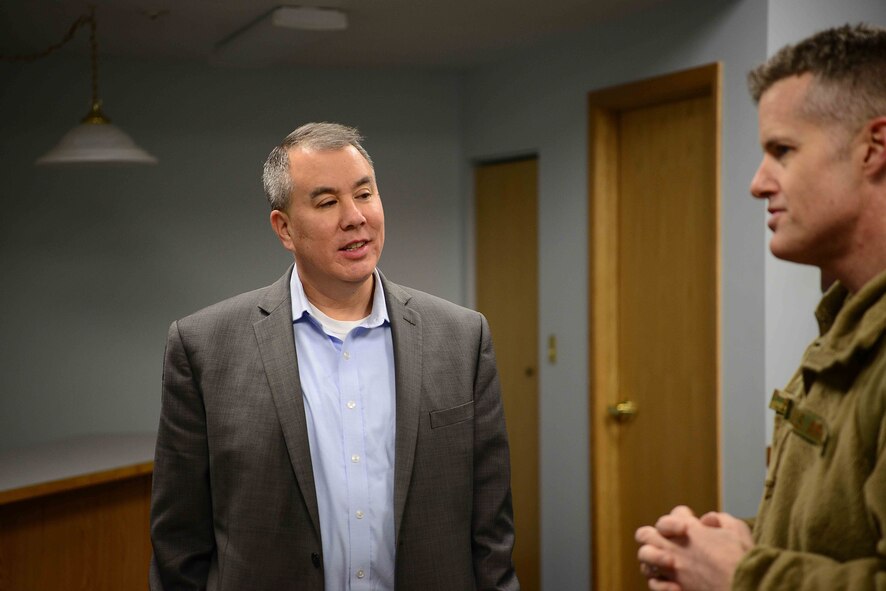 The Honorable John Rood, Under Secretary of Defense for Policy talks with Col. Benjamin Bishop, 354th Fighter Wing commander, at Eielson Air Force Base, AK, Dec. 8, 2019.