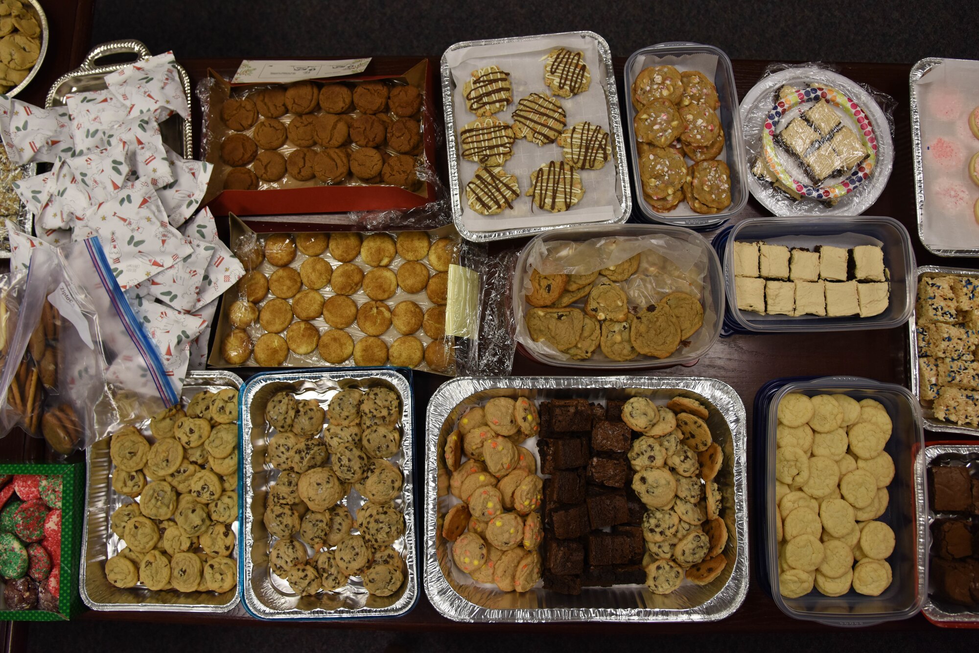 Cookies brought in for the cookie drop-off wait to be packaged Dec. 12, 2019, at the Airmen and Family Readiness Center at McConnell Air Force Base, Kan. Over 200 dozen cookies, brownies, and other treats were brought in to be delivered to Airmen. (U.S. Air Force photo by Airman 1st Class Marc A. Garcia)