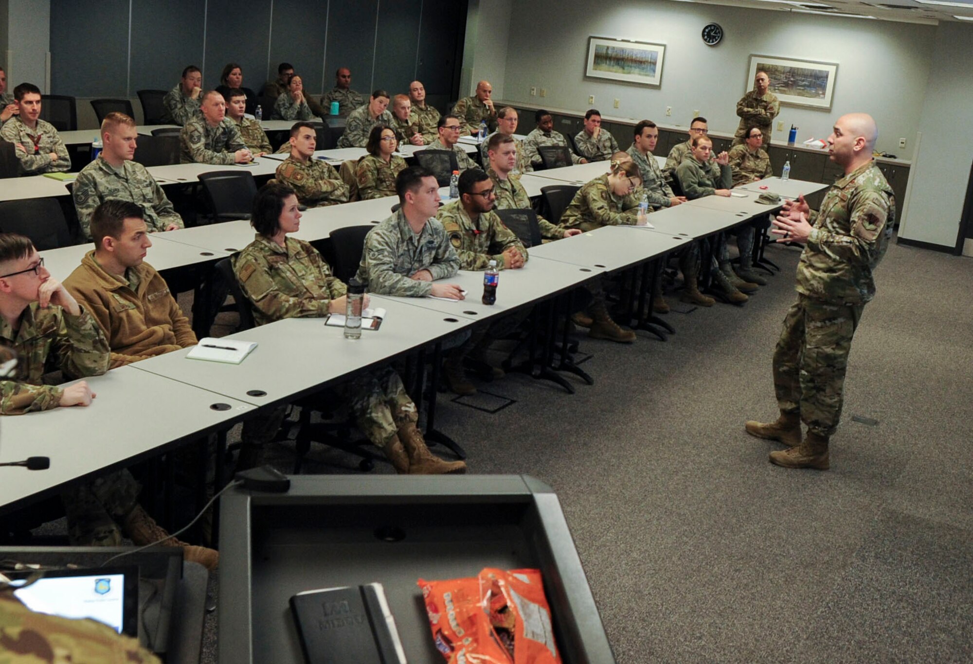 Master Sgt. Juan Villa, 18th Intelligence Squadron first sergeant, briefs a group of officers, enlisted and civilians on non-judicial punishment during a First Sergeant’s Panel on the progressive discipline model at Wright-Patterson Air Force Base, Ohio, Dec. 11, 2019. The panel provided first sergeants from a variety of squadrons with an avenue to share their experience concerning progressive discipline and best practices for leading and mentoring subordinates. (U.S. Air Force photo by Staff Sgt. Seth Stang)