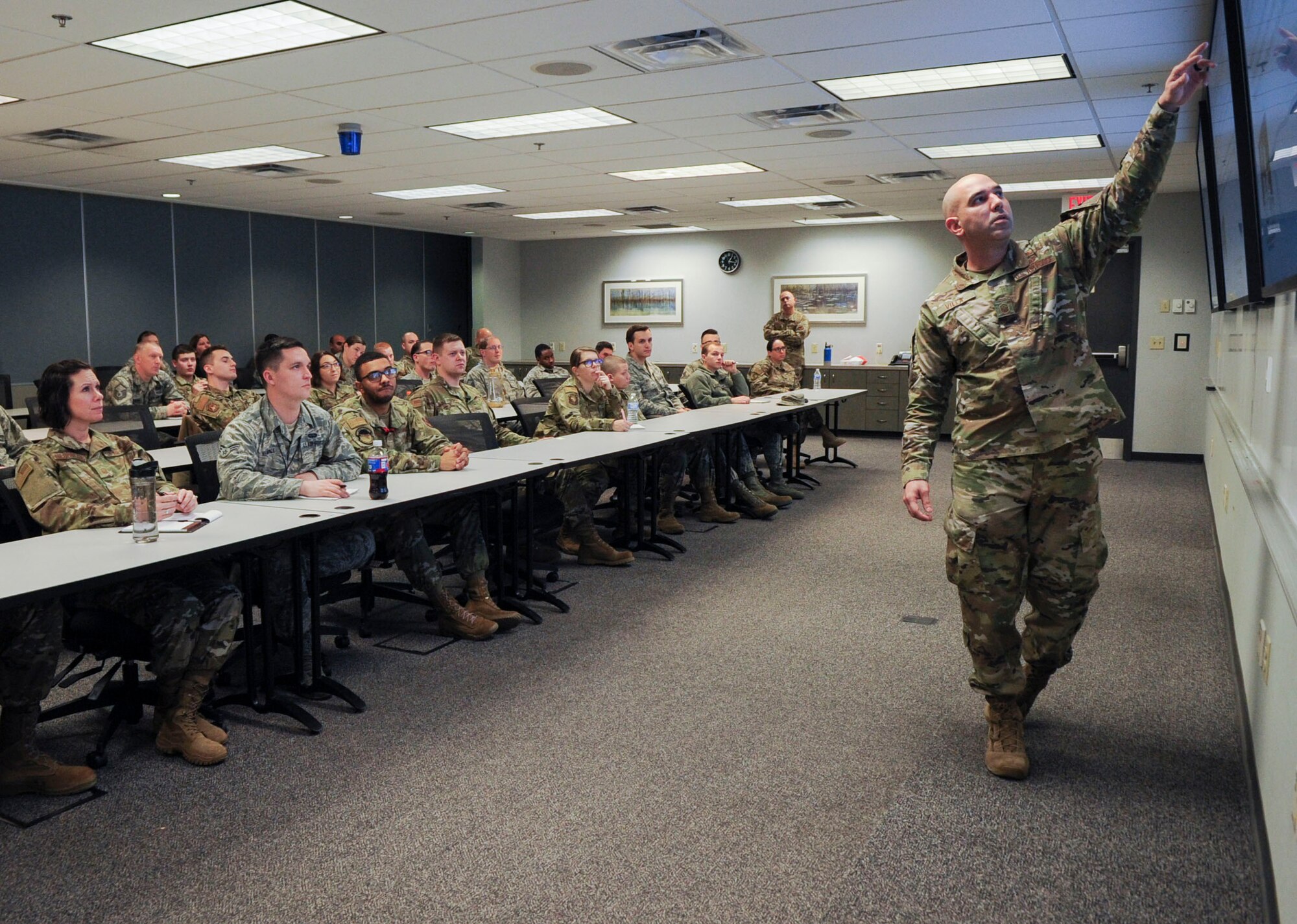 Master Sgt. Juan Villa, 18th Intelligence Squadron first sergeant, gives a briefing on non-judicial punishment during a First Sergeant’s Panel on the progressive discipline model at Wright-Patterson Air Force Base, Ohio, Dec. 11, 2019. The panel provided first sergeants from a variety of squadrons with an avenue to share their experience concerning progressive discipline and best practices for leading and mentoring subordinates. (U.S. Air Force photo by Staff Sgt. Seth Stang)