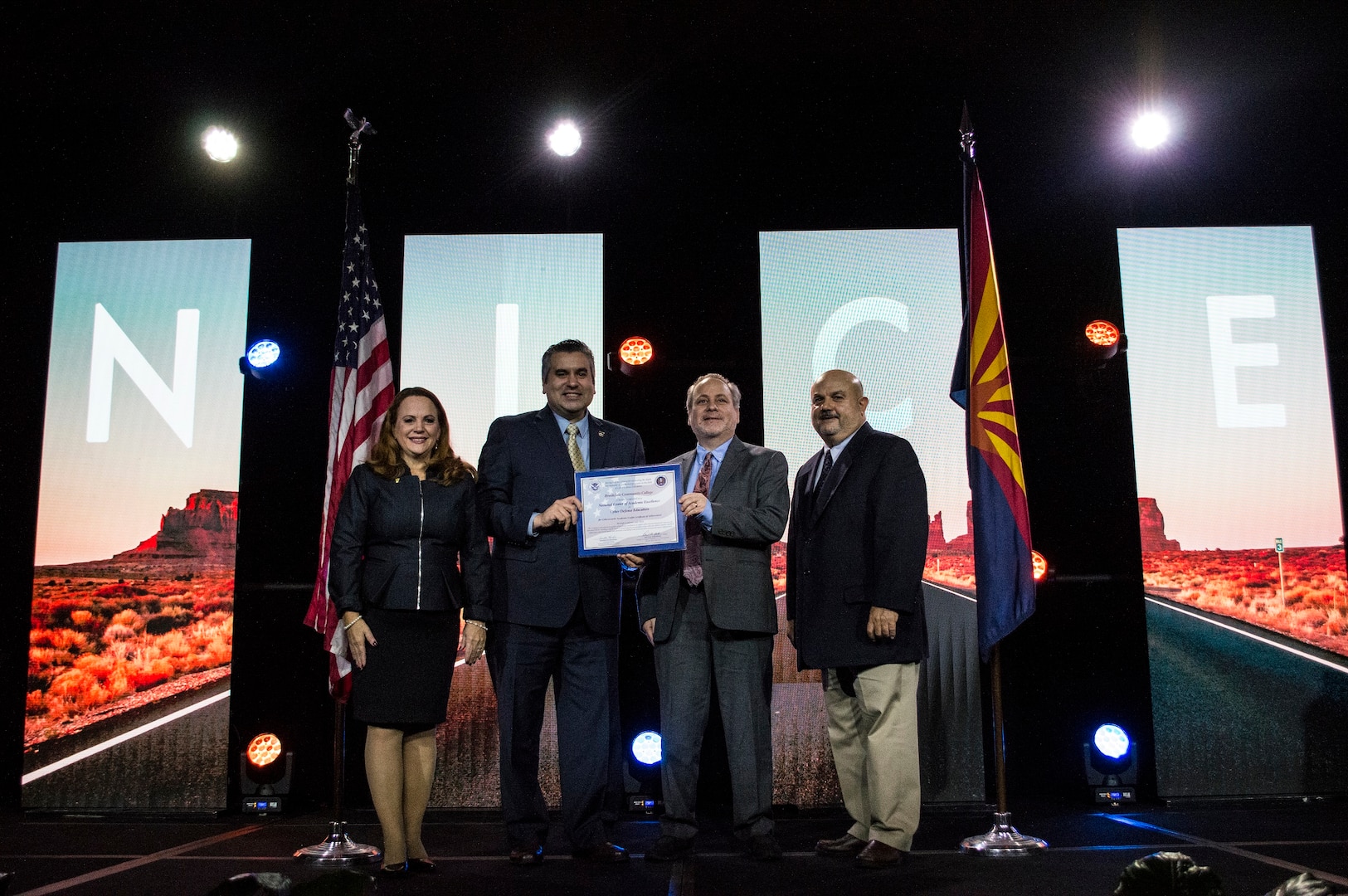 Brookdale Community College was among the academic institutions recognized during the November 2019  NICE conference.  Left to right - Diane M. Janosek, Dr. David Stout - President, Brookdale Community College, Michael Quissaunee - Chair and Professor, Engineering and Technology Department, and Keith Holternmann, Chief Learning Officer, Cybersecurity an Infrastructure Security Agency (CISA/DHS).