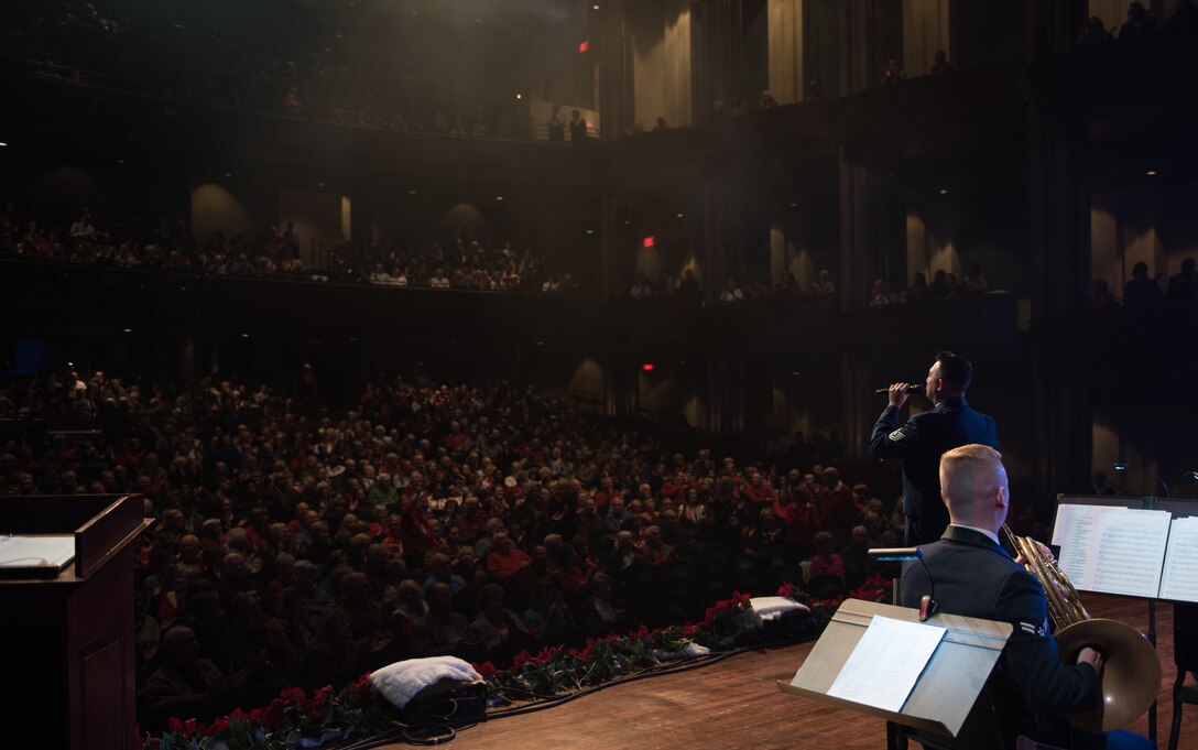 A member of the U.S. Air Force Heritage of America band performs a solo during a holiday concert at the Christopher Newport University Ferguson Center, Newport News, Virginia, Dec. 5, 2019. The concert provided people the opportunity to hear their favorite holiday songs performed live. (U.S. Air Force photo by Airman 1st Class Sarah Dowe)