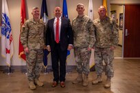 Joint Task Force Civil Support (JTF-CS) Commanding General U.S. Maj. Gen. William “Bill” Hall (left) and Command Senior Enlisted Leader U.S. Air Force Chief Master Sgt. James Brown (right) pose for a photo with Deputy Assistant Secretary of Defense for Homeland Defense Integration and Defense Support of Civil Authorities Robert Salesses (middle left) and Senior Military Advisor for Radiological and Nuclear Defense U.S. Army Col. Todd Viar (middle right) during their visit to JTF-CS headquarters at Joint Base Langley-Eustis. The visit included a brief with the JTF-CS leadership and an operations technology demonstration. (Official DoD photo by Mass Communication Specialist 3rd Class Michael Redd/RELEASED)