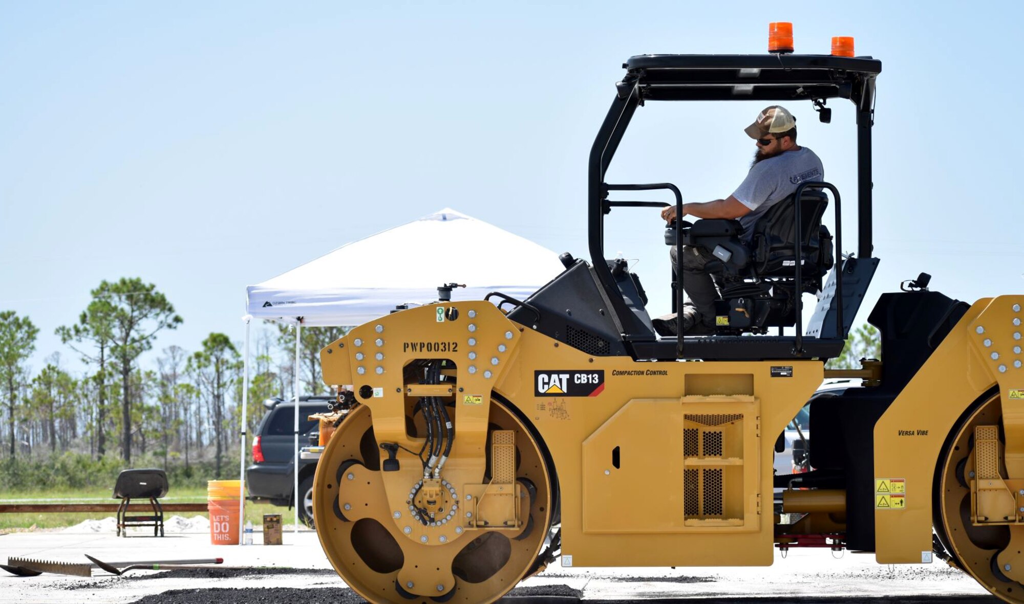 As part of the final phase off capping a crater, the pavements team with the Air Force Civil Engineer Center uses a steel drum compactor at the backfill event on July 16, 2019 at the 9700 Area at Tyndall Air Force Base, Florida. (U.S. Air Force photo by Grace Bland)