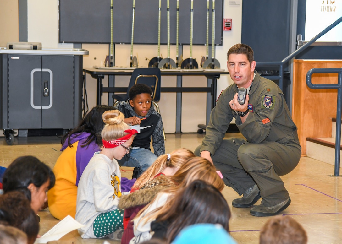 Maj. Ben Gilliland, Orange Flag Director, 411th Flight Test Squadron, explains GPS location navigation to a group of STARBASE Edwards Students at Edwards Air Force Base, California, Dec. 10. (Air Force photo by Giancarlo Casem)