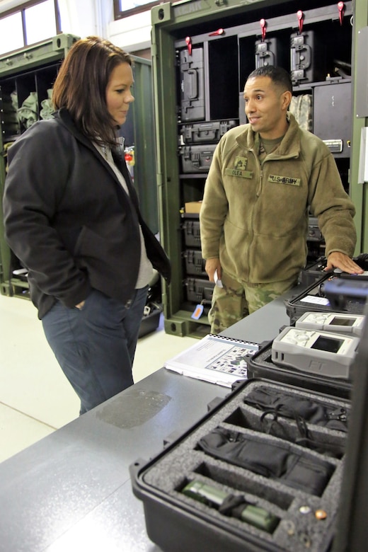 U.S. Army Reserve Staff Sgt. Erick Olea, a survey team chief with the 773rd Civil Support Team, 7th Mission Support Command, explains the capabilities inside the dismounted reconnaissance sets-kits-outfits to Dr. Brandi C. Vann, deputy assistant secretary of defense for U.S. Chemical and Biological Defense, while she tours the 773rd headquarters on Panzer Kaserne in Kaiserslautern, Germany, December 11, 2019. The 773rd is the only Civil Support Team in the U.S. Army Reserve and the European theater of operations. (U.S. Army Reserve photo by Sgt. 1st Class Joy Dulen)