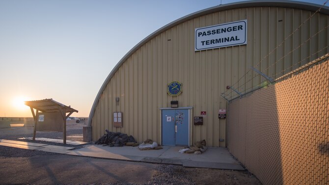 The sun is shown rising behind the passenger terminal at Ali Al Salem Air Base, Kuwait, Nov. 20, 2019. Since July, more than 55,000 service members and civilians traveled to and from Ali Al Salem. (U.S. Air Force photo by Tech. Sgt. Daniel Martinez)