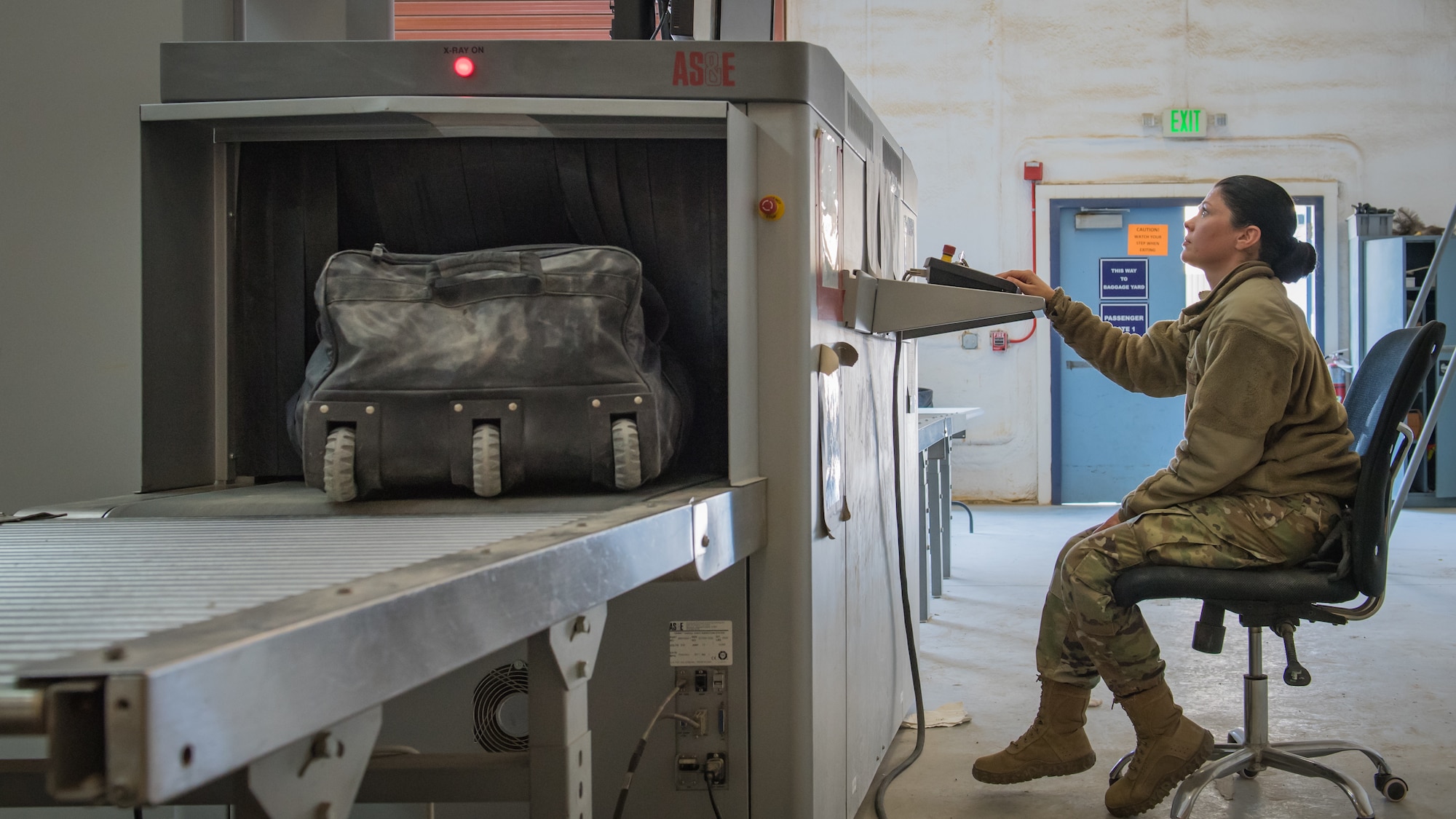 Senior Airman Candance Schmitz, 386th Expeditionary Logistics Readiness Squadron air transportation specialist, x-rays the bags of departing U.S. Army Soldiers at the passenger terminal on Ali Al Salem Air Base, Kuwait, Nov. 21, 2019. Since July, more than 55,000 service members and civilians traveled to and from Ali Al Salem. (U.S. Air Force photo by Tech. Sgt. Daniel Martinez)