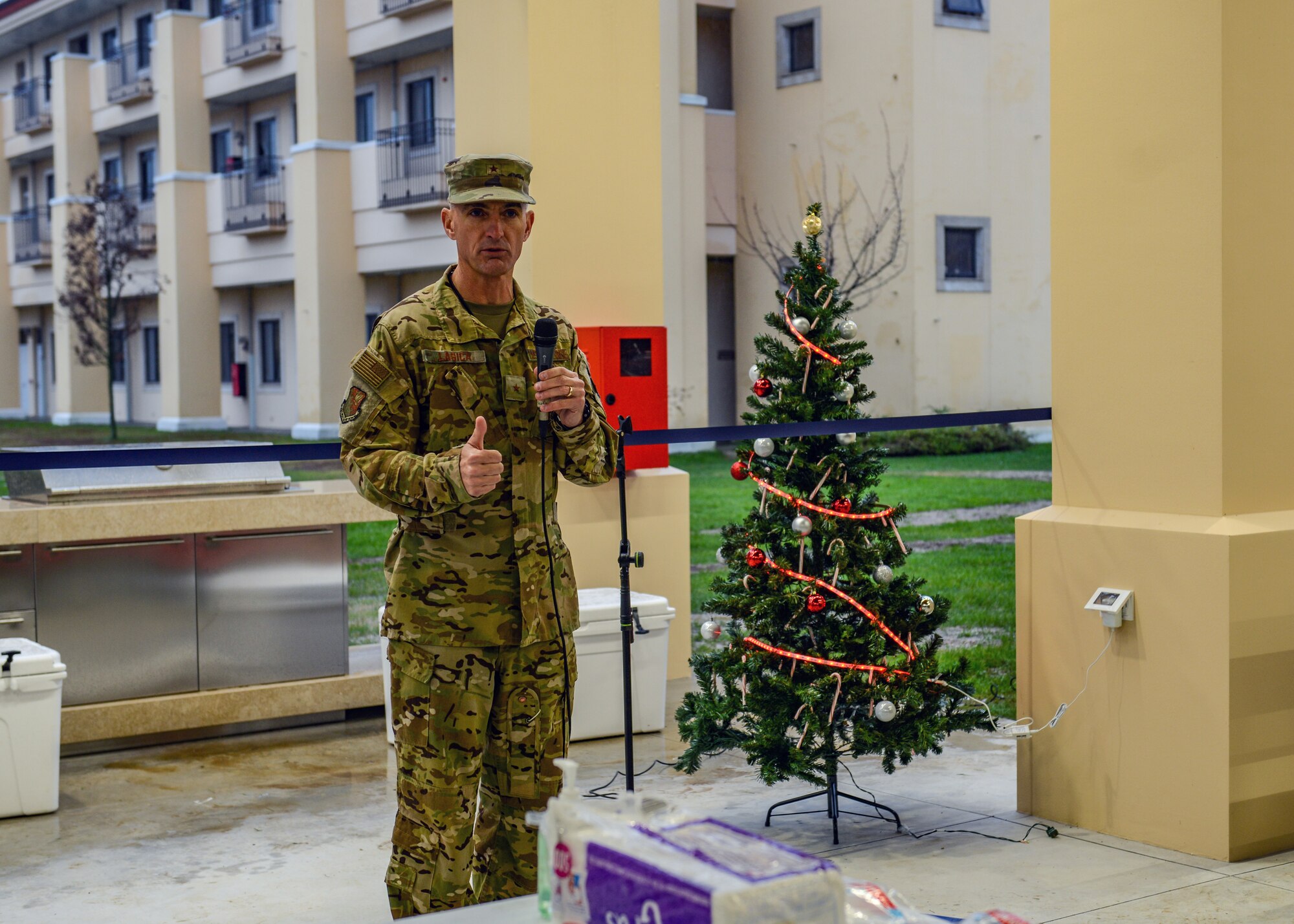 U.S. Air Force Brig. Gen. Daniel T. Lasica, 31st Fighter Wing commander, gives a speech for the grand opening of a new dorm pavilion at Aviano Air Base, Italy, Dec. 13, 2019. The pavilion was constructed for dorm Airmen to be able to relax and enjoy their free time. (U.S. Air Force photo by Airman Thomas S. Keisler IV)