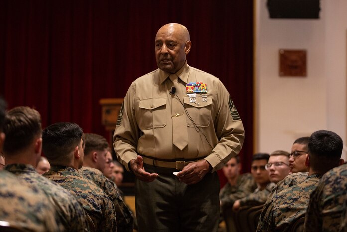 Retired Sgt. Maj. John Canley, Medal of Honor Recipient, speaks to Marines of the 31st Marine Expeditionary Unit and 3rd Marine Expeditionary Force on Camp Hansen, Okinawa, Japan, Dec. 11.