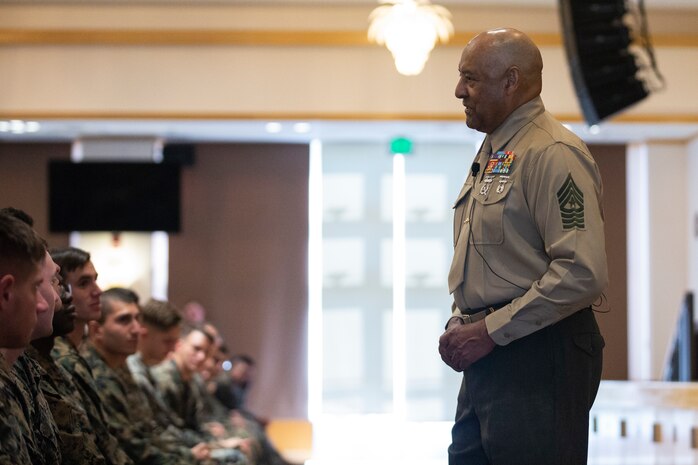 Retired Sgt. Maj. John Canley, Medal of Honor Recipient, speaks to Marines of the 31st Marine Expeditionary Unit and 3rd Marine Expeditionary Force on Camp Hansen, Okinawa, Japan, Dec. 11.