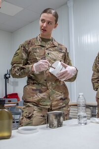 U.S. Army Spc. Shelby Vermeulen, with 1st Squadron, 303rd Cavalry Regiment, 96th Troop Command, Washington Army National Guard, works through the steps of water purification during a Field Sanitation Team Certification Course Dec. 9-13, 2019, at Joint Training Center-Jordan.