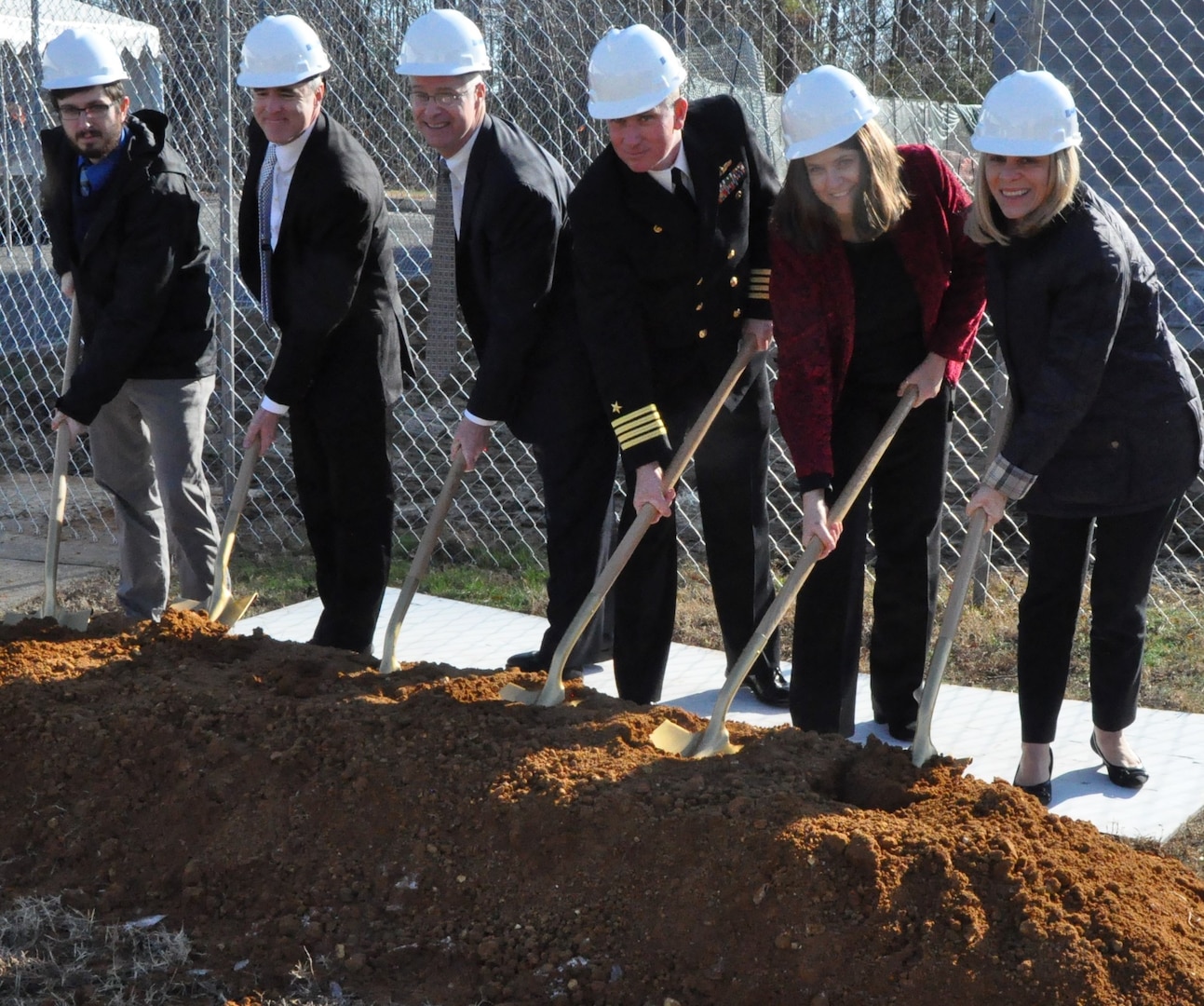 IMAGE: DAHLGREN, Va. (Dec. 12, 2019) – Navy officials, including Naval Surface Warfare Center Dahlgren Division (NSWCDD) leadership, break ground for the command’s new Cyber Warfare Engineering Laboratory, Dec. 12. The facility will bring together the building blocks of existing capabilities into one place to provide a robust and flexible software and hardware testing capability for Department of Defense and Navy weapon systems, cyber and network platforms in addition to industrial control systems supporting DoD infrastructure. From left to right: Christopher Keener, NSWCDD cyber engineer; Darren Barnes, NSWCDD acting technical director; Scott St. Pierre, Enterprise Information Technology officer, Naval Sea Systems Command; Capt. Casey Plew, NSWCDD commanding officer; Shellie Clift, NSWCDD Strategic and Computing Systems Department head; Nancy Fitzgerald, principal, CFM Engineering. (Photo by U.S. Navy/Released)