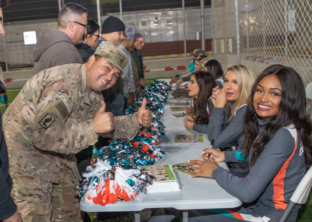 Miami Dolphins spread holiday cheer to troops in Jordan