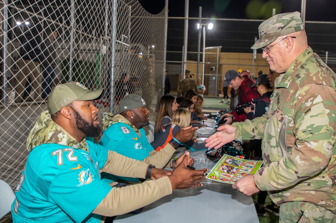 Miami Dolphins spread holiday cheer to troops in Jordan