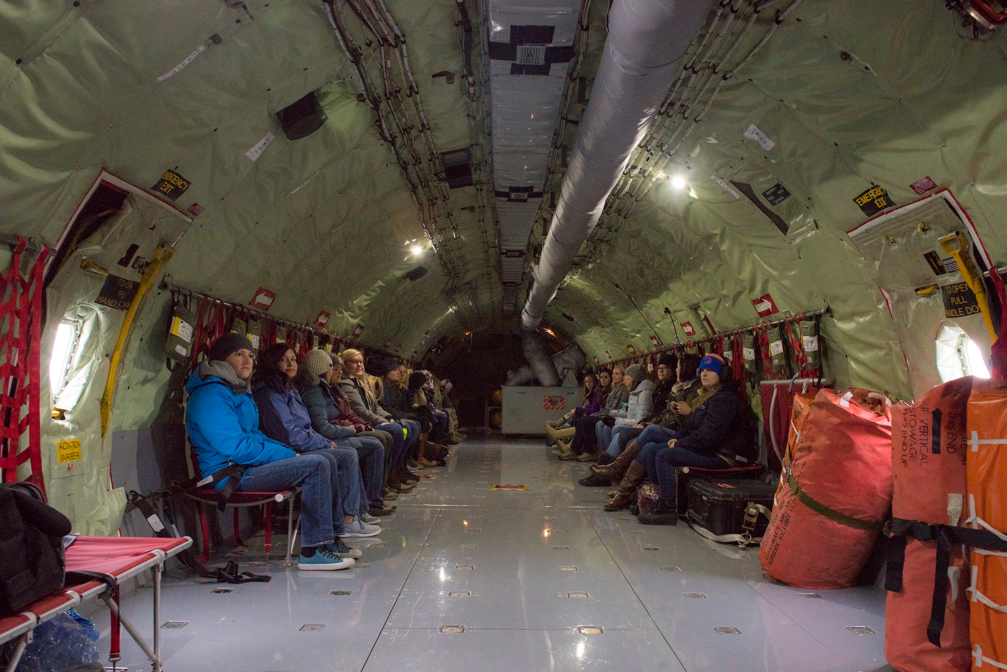 Spouses of Airmen from the 124th Fighter Wing await takeoff on a KC-135 Stratotanker assigned to the Utah Air National Guard’s 151st Air Refueling Wing, at Gowen Field, Dec. 7, 2019. The Idaho and Utah Air National Guard units collaborated to support an in-flight refueling experience for spouses of Airmen from the 124th FW. (U.S. Air National Guard photo by Airman 1st Class Taylor Walker)