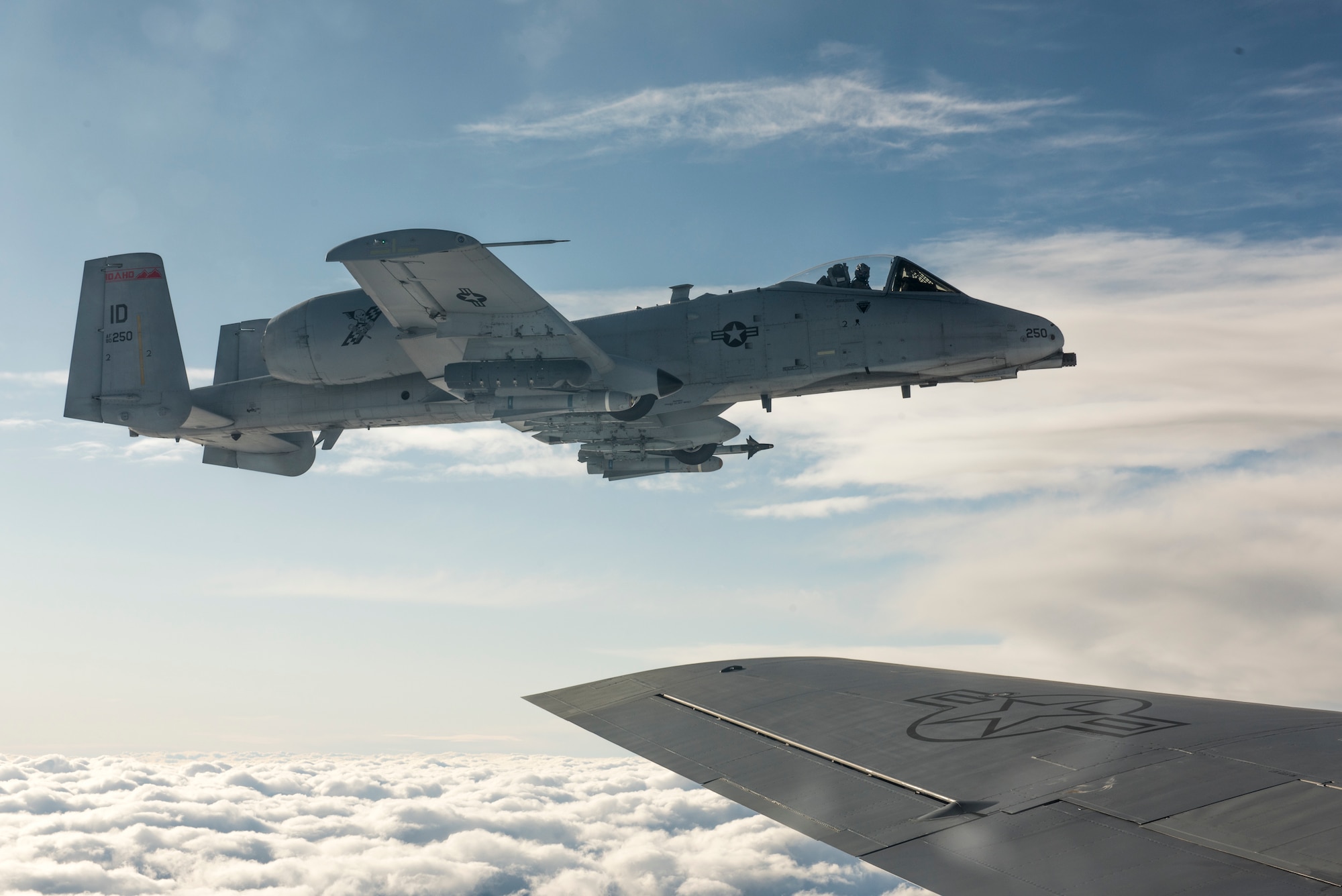 An A-10 Thunderbolt || assigned to the 190th Fighter Squadron flies next to a KC-135 Stratotanker assigned to the Utah Air National Guard’s 151st Air Refueling Wing, over Southwest Idaho, Dec. 7, 2019. The Idaho and Utah Air National Guard units collaborated to support an in-flight refueling experience for spouses of Airmen from the 124th Fighter Wing. (U.S. Air National Guard photo by Airman 1st Class Taylor Walker)