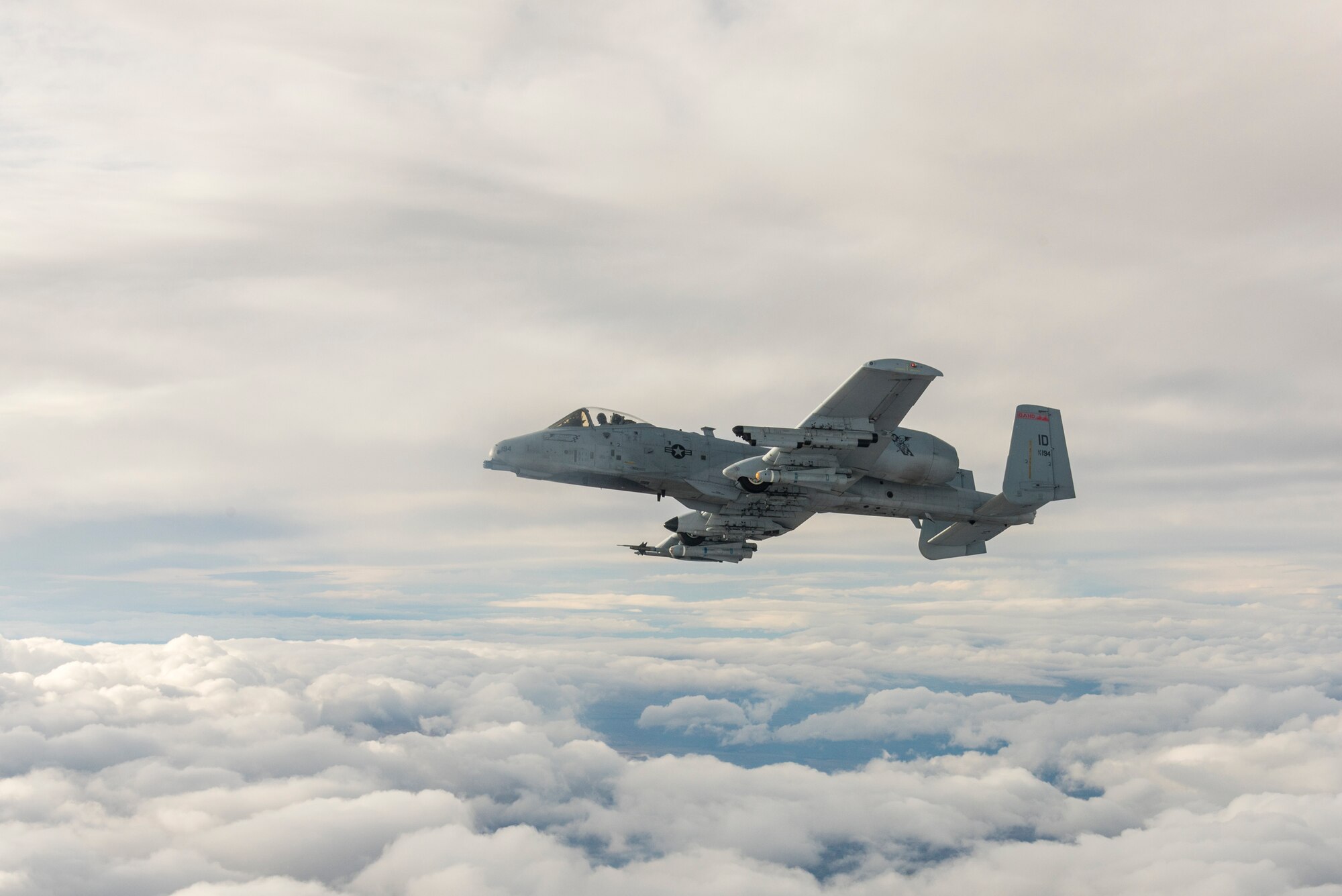 An A-10 Thunderbolt || assigned to the 190th Fighter Squadron flies next to a KC-135 Stratotanker assigned to the Utah Air National Guard’s 151st Air Refueling Wing, over Southwest Idaho, Dec. 7, 2019. The Idaho and Utah Air National Guard units collaborated to support an in-flight refueling experience for spouses of Airmen from the 124th Fighter Wing. (U.S. Air National Guard photo by Airman 1st Class Taylor Walker)