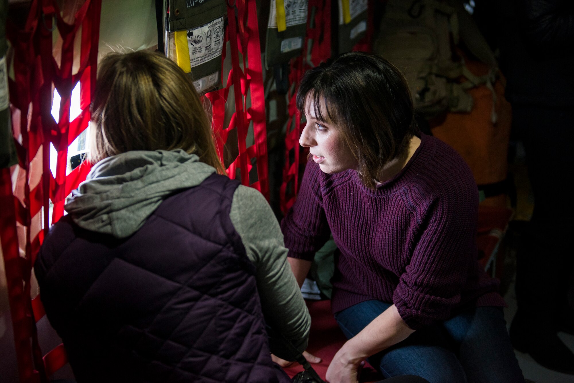 Wives of Airmen from the 124th Fighter Wing look out the window of a KC-135 Stratotanker assigned to the Utah Air National Guard’s 151st Air Refueling Wing, over Southwest Idaho, Dec. 7, 2019. The Idaho and Utah Air National Guard units collaborated to support an in-flight refueling experience for spouses of Airmen from the 124th FW. (U.S. Air National Guard photo by Airman 1st Class Taylor Walker)