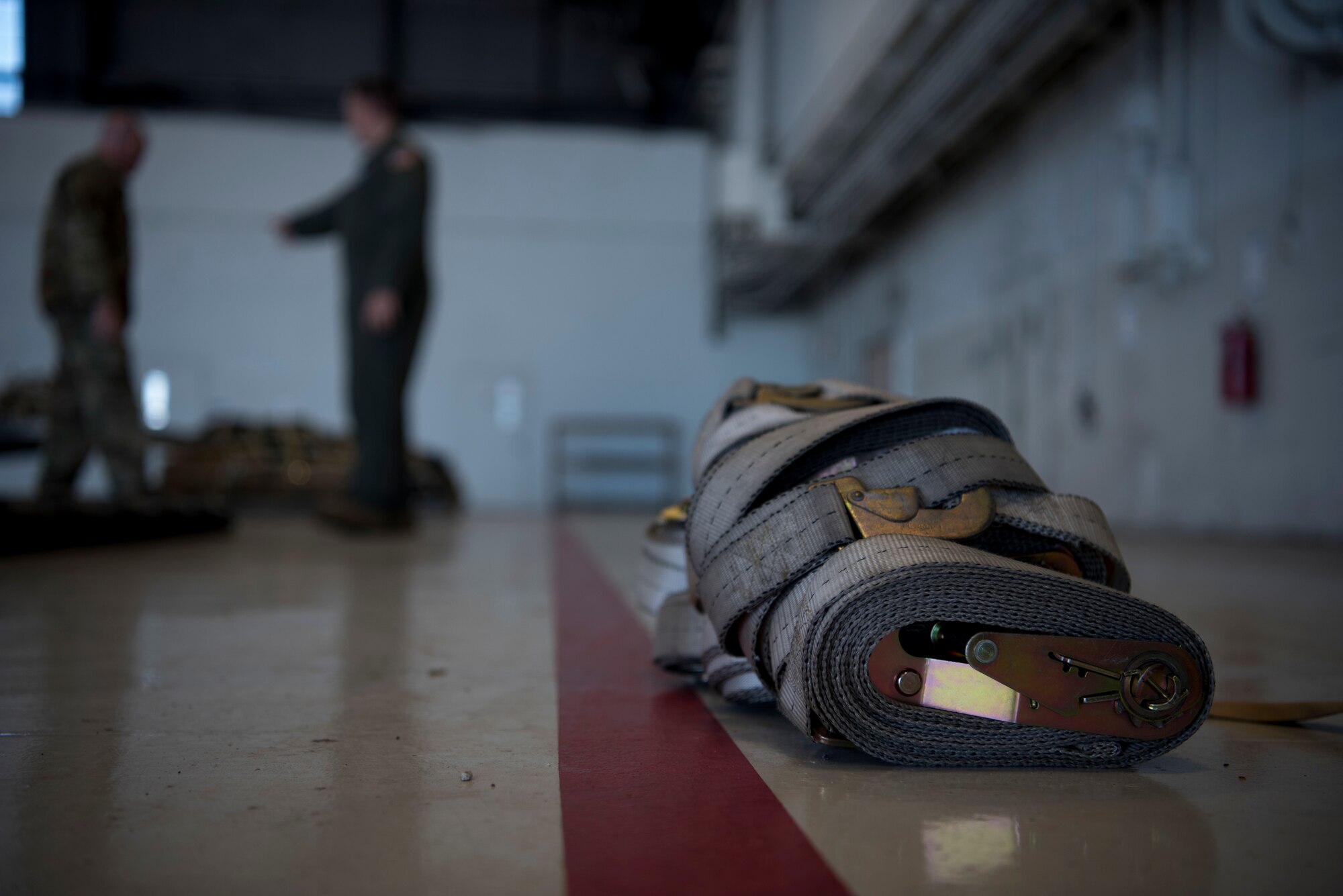 Ratchet straps lay on the floor next to built cargo pallets at MacDill Air Force Base, Fla., Dec. 6, 2019.