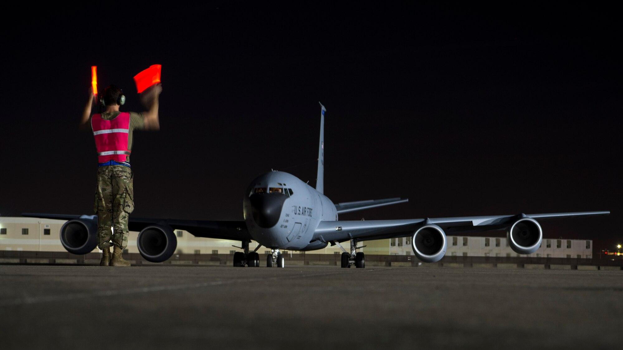 A 6th Aircraft Maintenance Squadron crew chief marshals a KC-135 Stratotanker aircraft before taxiing for takeoff from MacDill Air Force Base, Fla., Dec. 9, 2019.