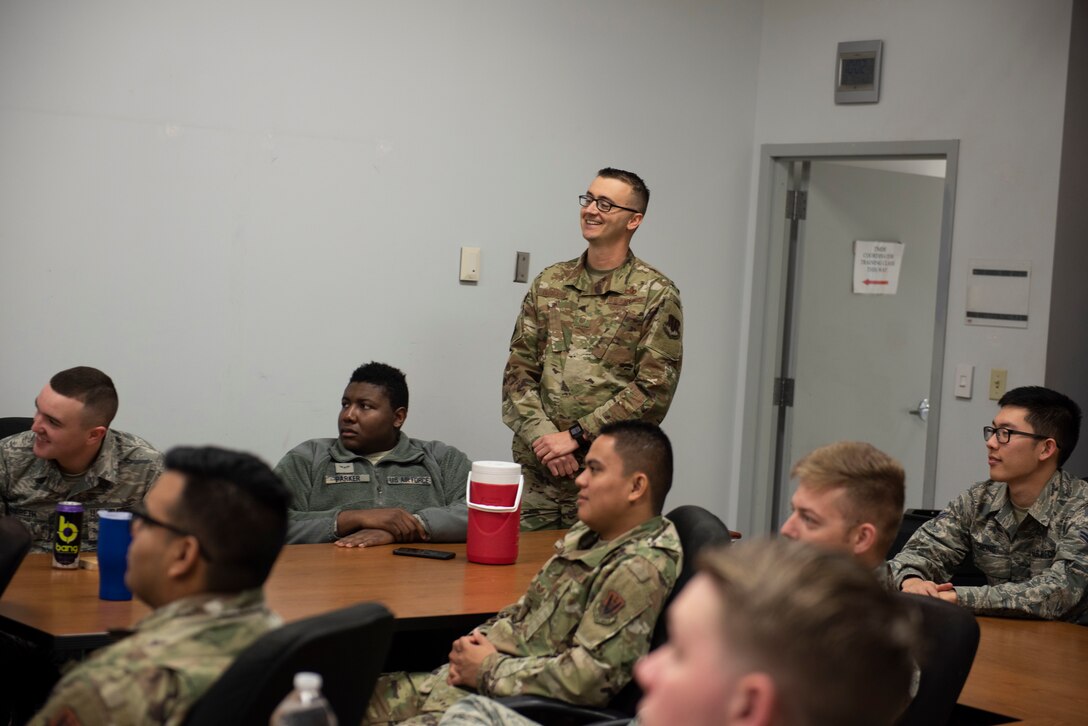 U.S. Air Force 20th Component Maintenance Squadron (CMS) Precision Measurement Equipment Laboratory (PMEL) Airmen smile as they receive a certificate of acceptable standards at Shaw Air Force Base, South Carolina, Dec. 5, 2019.