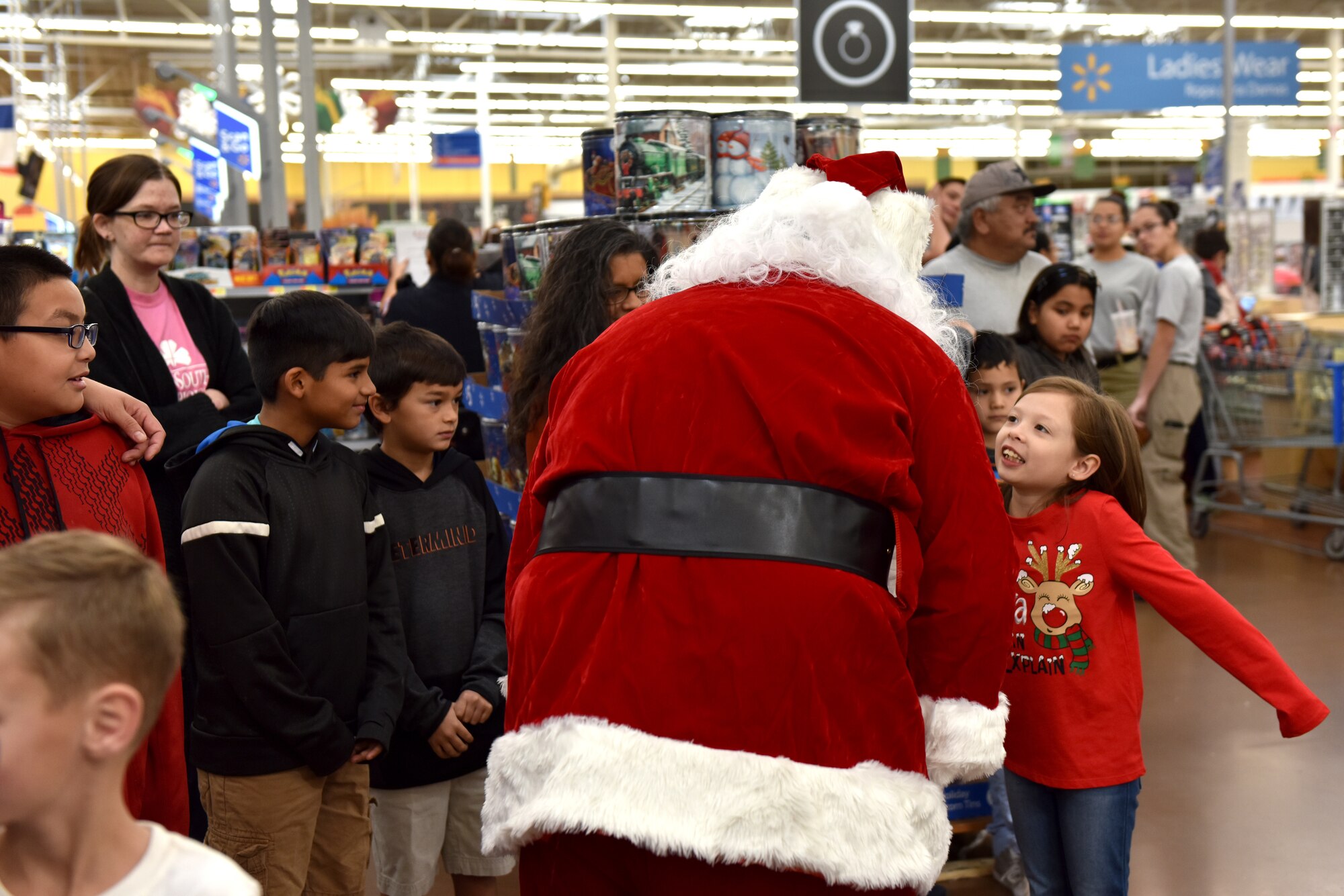 Children talk to Santa during Operation Blue Santa Shop with a Cop in San Angelo, Texas, Dec. 14, 2019. This is the 12th year that the San Angelo Coalition of Police coordinated with stores to help children shop for their families. (U.S. Air Forc photo by Senior Airman Seraiah Wolf)