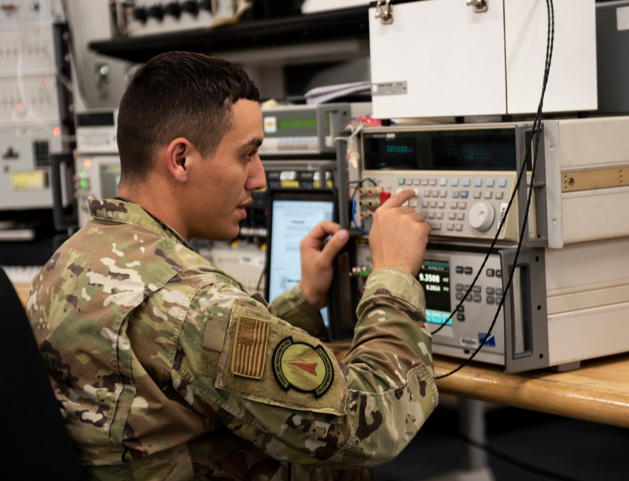 U.S. Air Force Staff Sgt. Steven Suarez, 20th Component Maintenance Squadron Precision Maintenance Evaluation Laboratory (PMEL) physical dimensional technician, calibrates electronic warfare fixtures, at Shaw Air Force Base, South Carolina, Dec. 12, 2019.