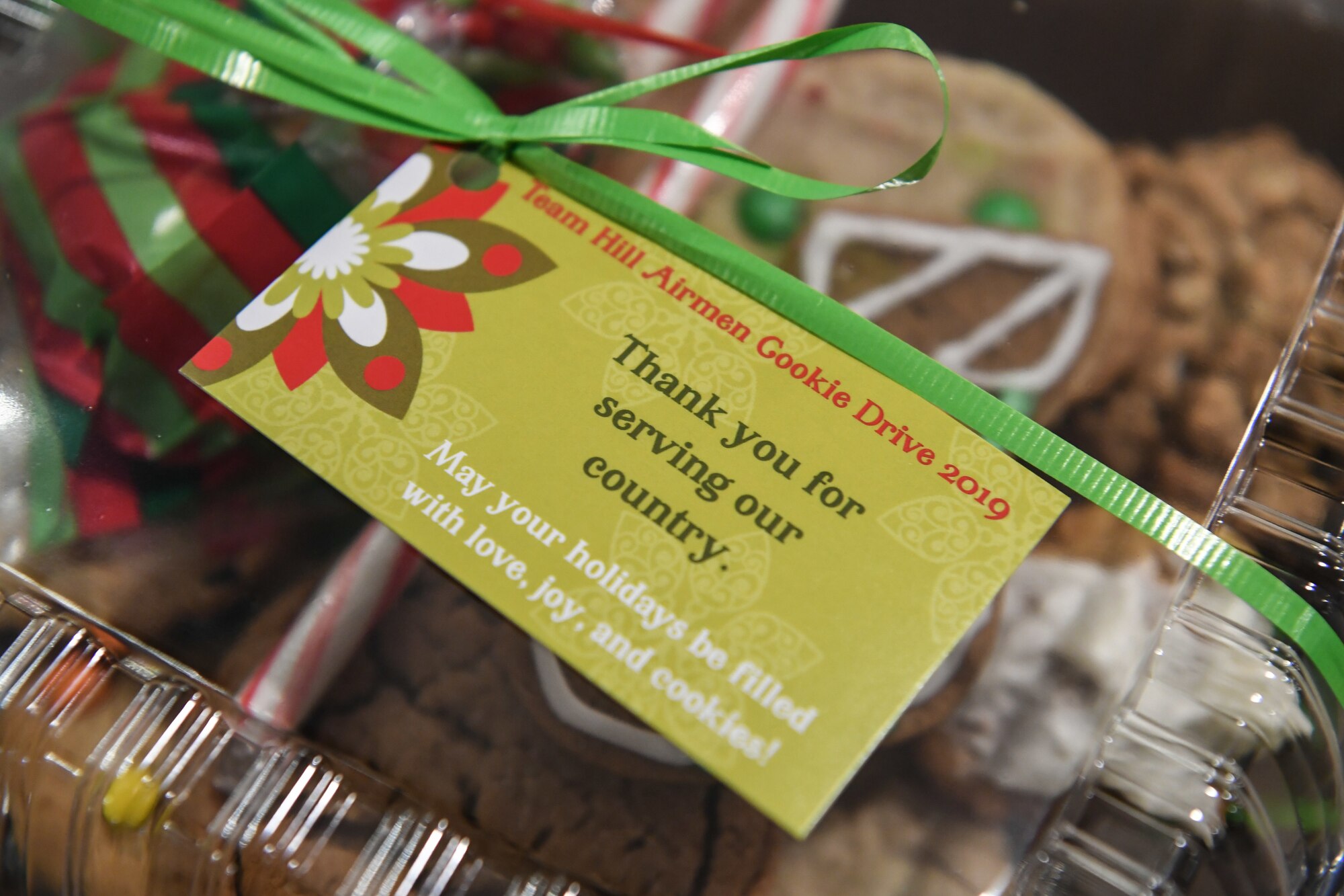 The label atop the holiday cookie package destined for various Airmen across Hill Air Force Base, Utah, Dec. 16, 2109, reads: "Thank you for serving our country. May your holidays be filled with love, joy, and cookies.” Every year, during the annual Team Hill Airman Cookie Drive, volunteers bake, collect, package and deliver cookies to the base's Airmen. (U.S. Air Force photo by Cynthia Griggs)