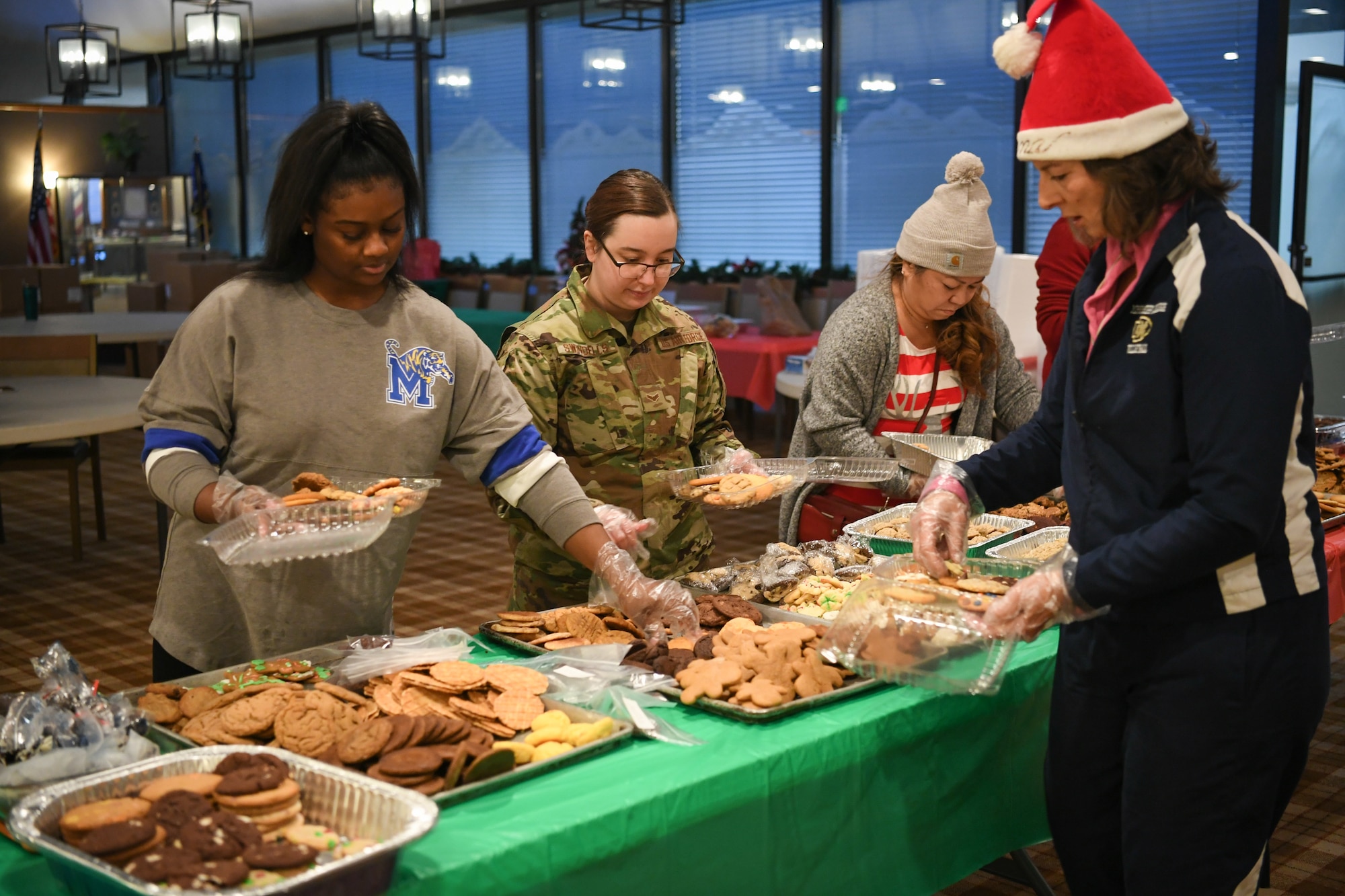 Volunteers pack up holiday cookies destined for various Airmen across Hill Air Force Base, Utah, Dec. 16, 2019, during the annual Team Hill Airmen Cookie Drive. Every year, volunteers bake, collect, package and deliver cookies to the base's Airmen. (U.S. Air Force photo by Cynthia Griggs)