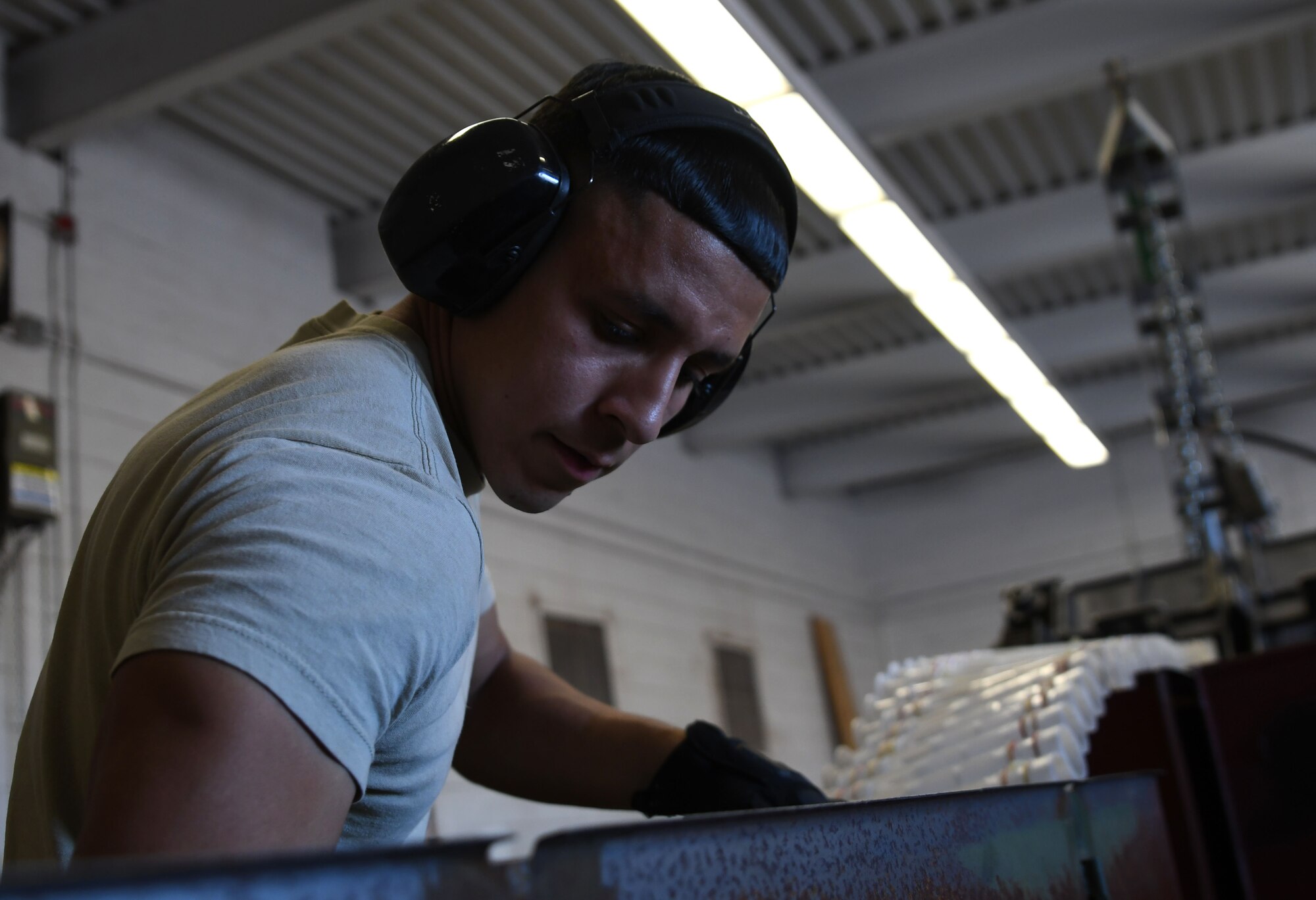 Photo of conventional maintenance technician organizing linked tube carriers