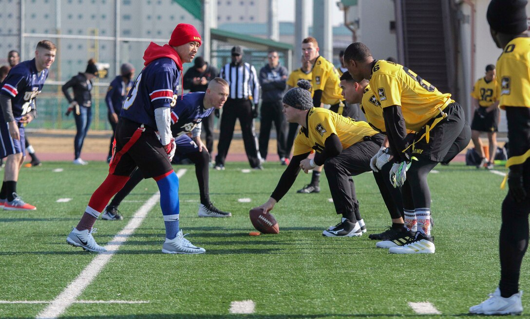 Marines, Sailors, and Soldiers competed om the Army vs. Navy flag football game aboard USAG Camp Humphreys 24 December. The teams played head to head for a trophy and bragging rights, while building comradery between services. (U.S. Marine Corps photo by Sgt. Parker R. Golz)