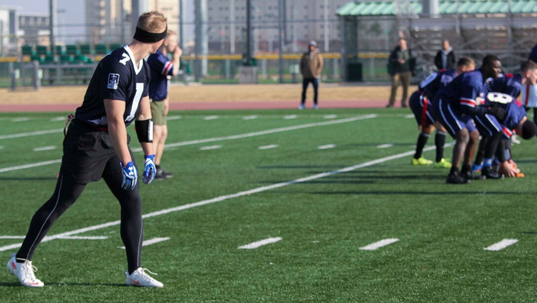 Marines, Sailors, and Soldiers competed om the Army vs. Navy flag football game aboard USAG Camp Humphreys 24 December. The teams played head to head for a trophy and bragging rights, while building comradery between services. (U.S. Marine Corps photo by Sgt. Parker R. Golz)