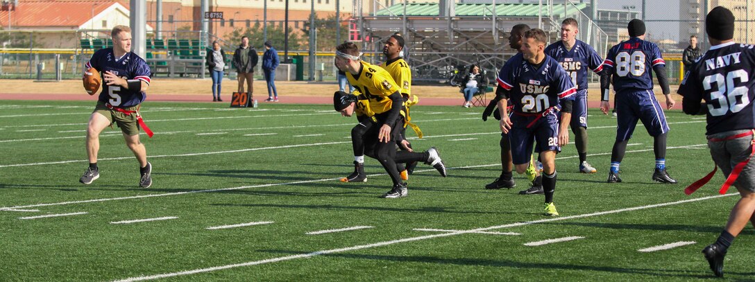 Marines, Sailors, and Soldiers competed om the Army vs. Navy flag football game aboard USAG Camp Humphreys 24 December. The teams played head to head for a trophy and bragging rights, while building comradery between services. (U.S. Marine Corps photo by Sgt. Parker R. Golz)