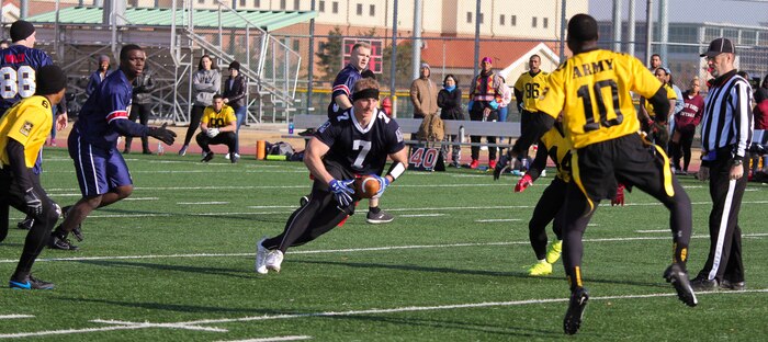 Marines, Sailors, and Soldiers competed om the Army vs. Navy flag football game aboard USAG Camp Humphreys 24 December. The teams played head to head for a trophy and bragging rights, while building comradery between services. (U.S. Marine Corps photo by Sgt. Parker R. Golz)