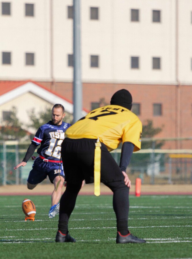Marines, Sailors, and Soldiers competed om the Army vs. Navy flag football game aboard USAG Camp Humphreys 24 December. The teams played head to head for a trophy and bragging rights, while building comradery between services. (U.S. Marine Corps photo by Sgt. Parker R. Golz)