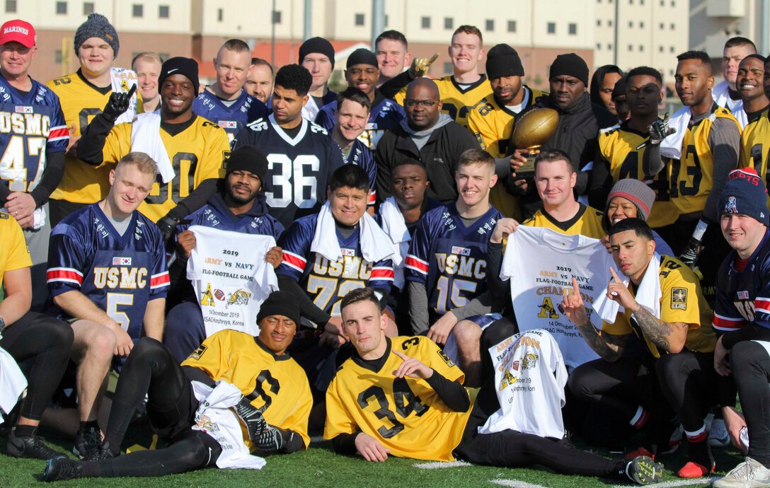 Marines, Sailors, and Soldiers competed om the Army vs. Navy flag football game aboard USAG Camp Humphreys 24 December. The teams played head to head for a trophy and bragging rights, while building comradery between services. (U.S. Marine Corps photo by Sgt. Parker R. Golz)