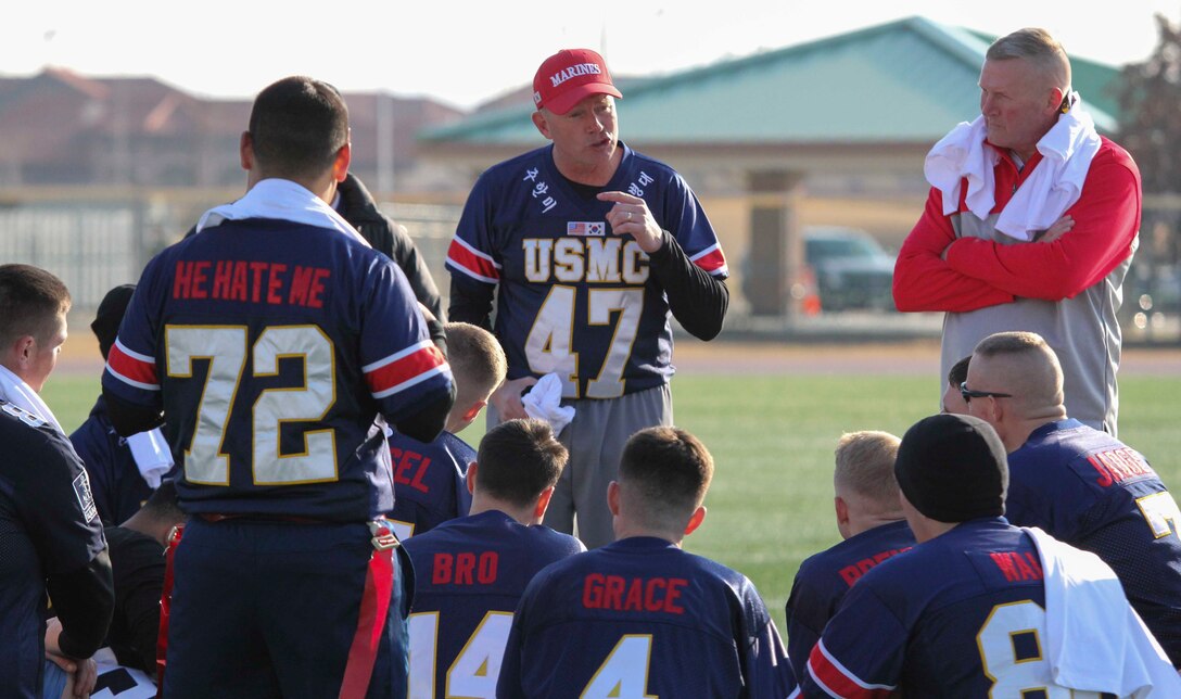 Marines, Sailors, and Soldiers competed om the Army vs. Navy flag football game aboard USAG Camp Humphreys 24 December. The teams played head to head for a trophy and bragging rights, while building comradery between services. (U.S. Marine Corps photo by Sgt. Parker R. Golz)