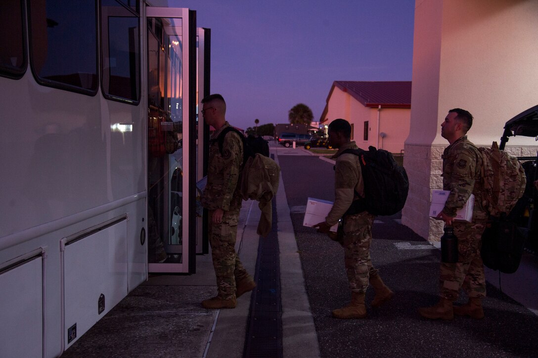 Members of the 91st Air Refueling Squadron (ARS) board a bus en route to a KC-135 Stratotanker aircraft at MacDill Air Force Base, Fla., Dec. 3, 2019.