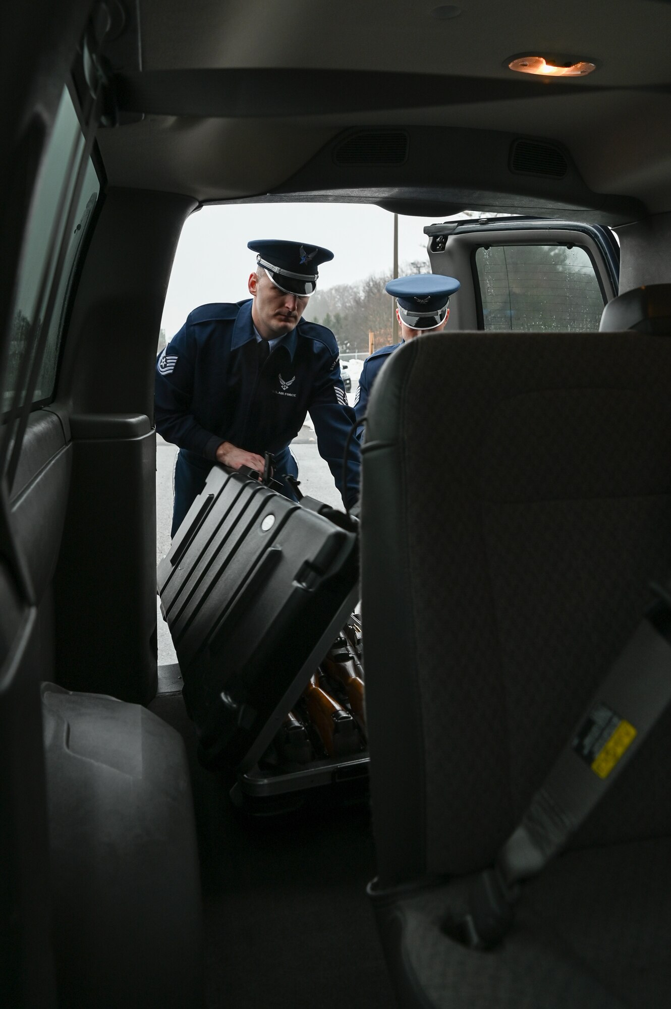 Tech. Sgt. Daniel Fox, left, and Tech. Sgt. Meldion Shehu, members of the Patriot Honor Guard at Hanscom Air Force Base, Mass., load equipment in a van for a military funeral detail in New York Dec. 9. Hanscom's Patriot Honor Guard provides funeral honor services in New England and Northeastern New York for active duty, retirees and veterans who served honorably in the United States Air Force. (U.S. Air Force photo by Mark Herlihy)