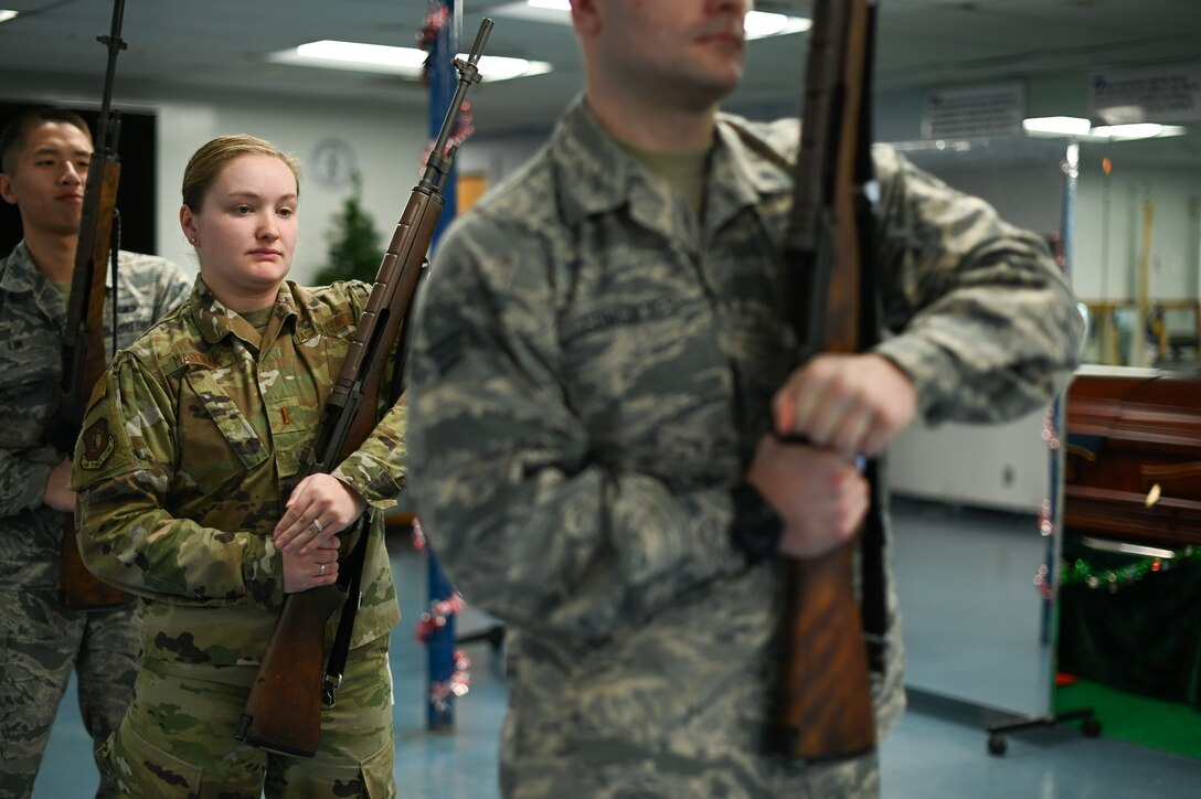 Second Lt. Amanda Marciniak, Patriot Honor Guard augmentee, practices with others during a training session at Hanscom Air Force Base, Mass., Dec. 12. The Patriot Honor Guard conducts training sessions each Thursday at their building for Airmen currently part of the augmentee program and those that are interested in joining the Honor Guard. (U.S. Air Force photo by Mark Herlihy)