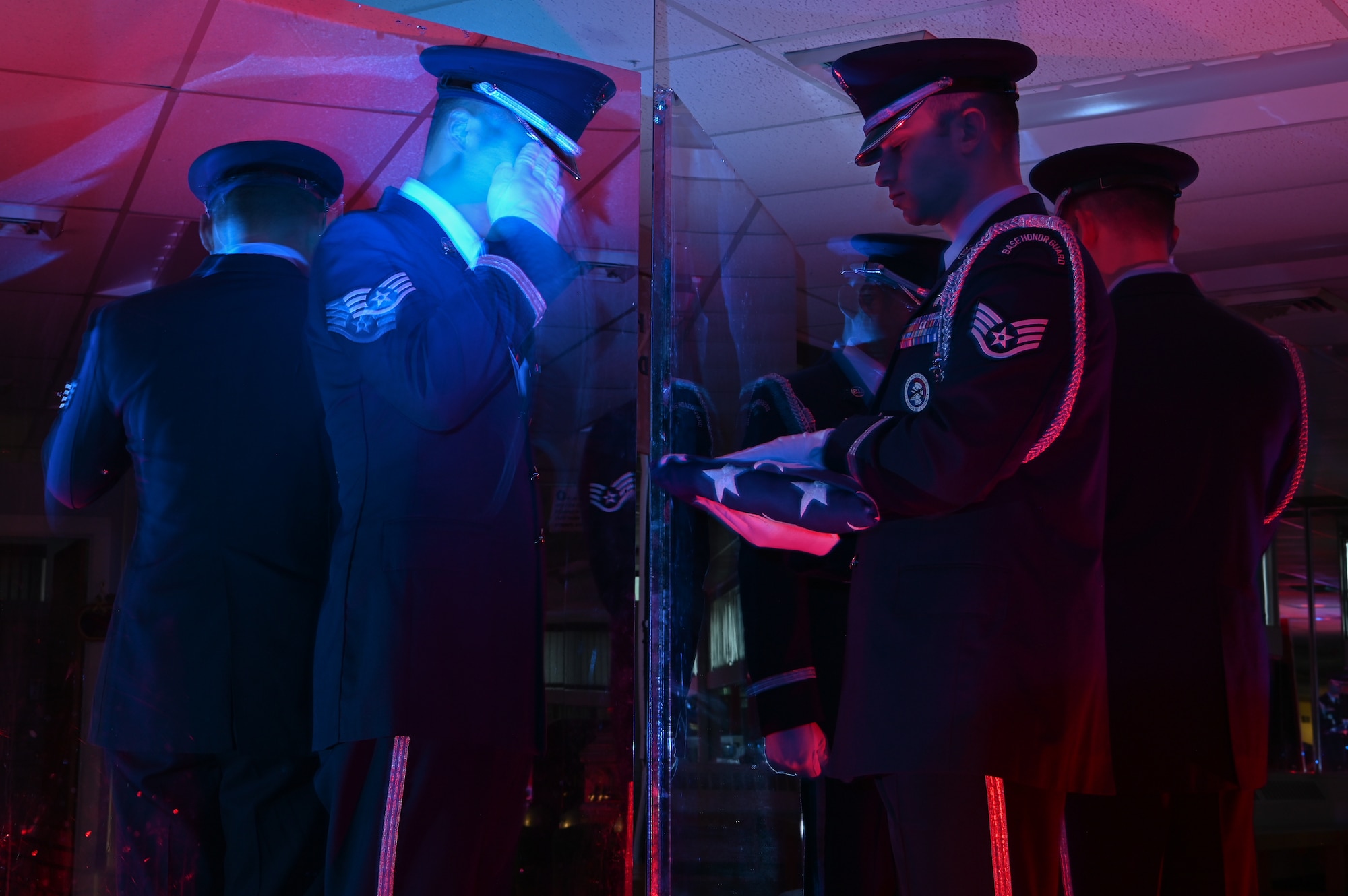 Staff Sgt. Christian Bagtas, left, salutes the flag held by Corey Silfen, Patriot Honor Guard ceremonial guardsmen, at Hanscom Air Force Base, Mass., Dec. 10. The Patriot Honor Guard participated in more than 2,300 funeral honors for active duty, retirees and veterans in New England and Northeastern New York in 2019. (U.S. Air Force photo by Mark Herlihy)