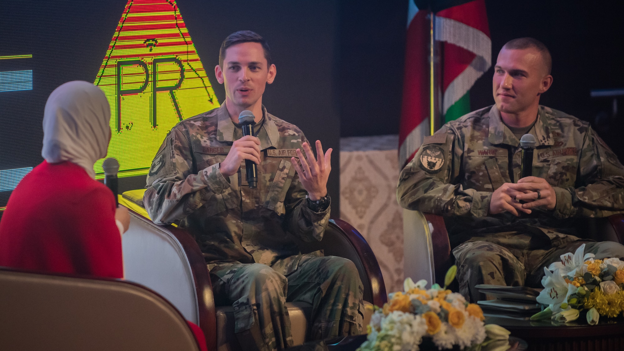 U.S. Air Force Capt. Thomas Barger, 386th Air Expeditionary Wing chief of public affairs, center, discusses elements of social media and crisis communication with Master Sgt. Daniel Ward, 386th Expeditionary Civil Engineer Squadron superintendent of emergency management, right, and a communications professor from the University of Kuwait during the Digital Public Relations Conference and Exhibition at the National LIbrary of Kuwait in Kuwait City, Dec. 11, 2019. "Digitalizing Strategic Communications for Confronting Public Relations Crisis" was the theme during this segment of the conference, which brought together U.S. military members to an audience of Kuwaiti government representatives, industry insiders, undergraduates, media and academics on effective crisis communication practices. (U.S. Air Force photo by Tech. Sgt. Daniel Martinez)